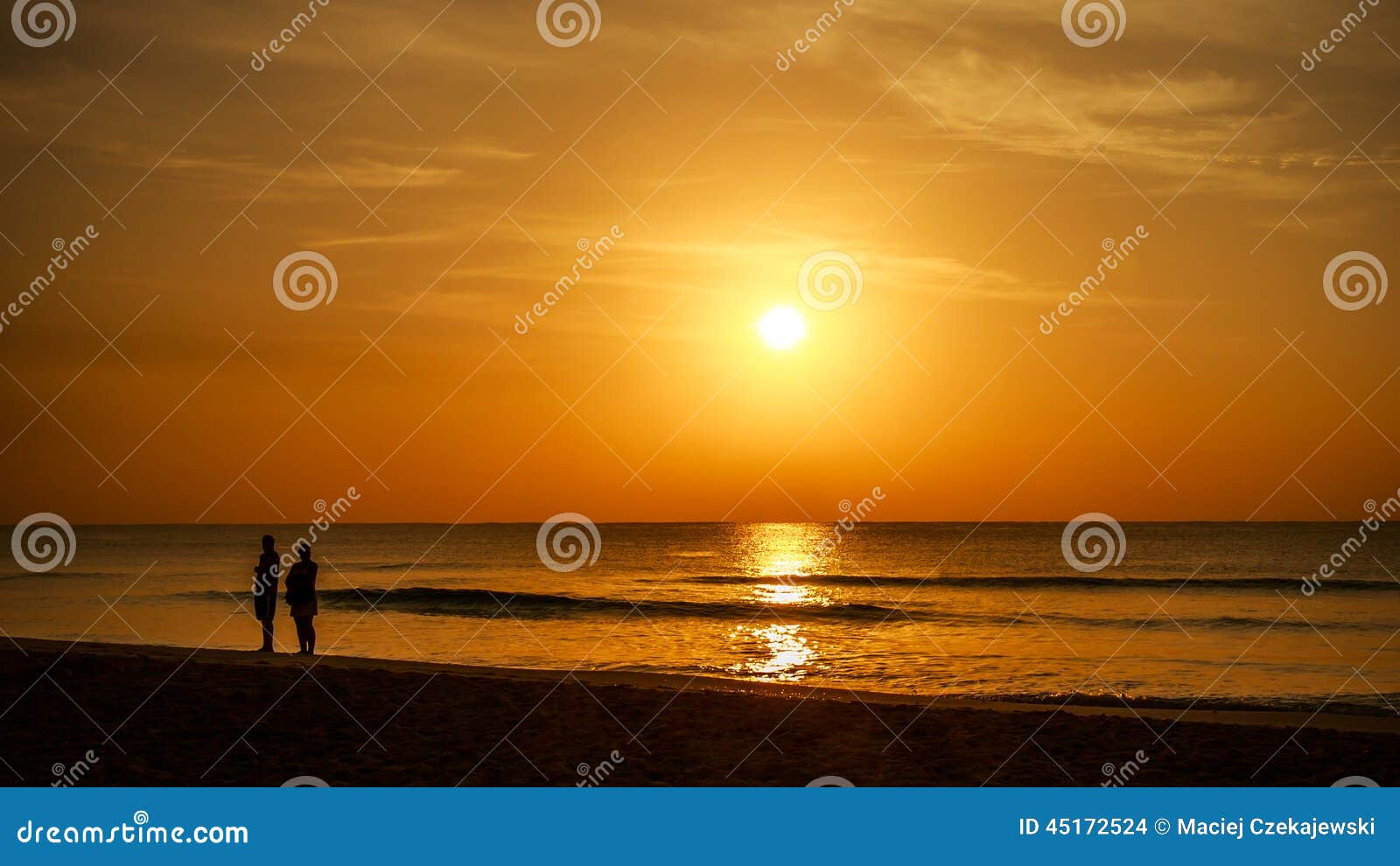 Walking down the beach stock photo. Image of orange, family - 45172524