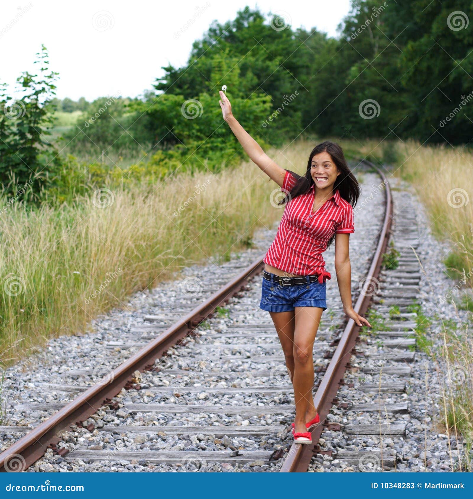 Girl Walking On Train Tracks girls walking on railroad tracks stock 