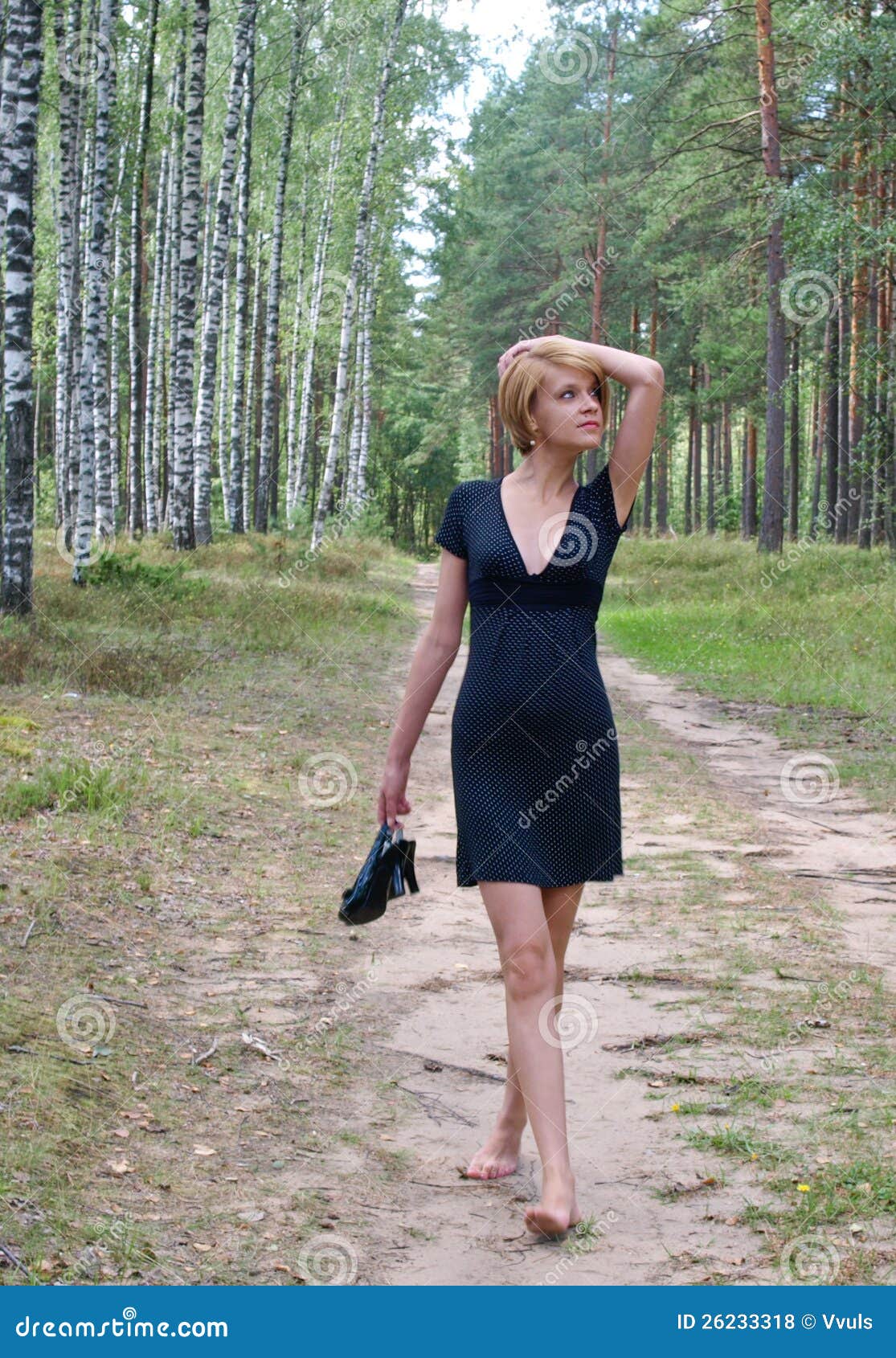 Walking with shoes in hand stock photo. Image of walk - 26233318