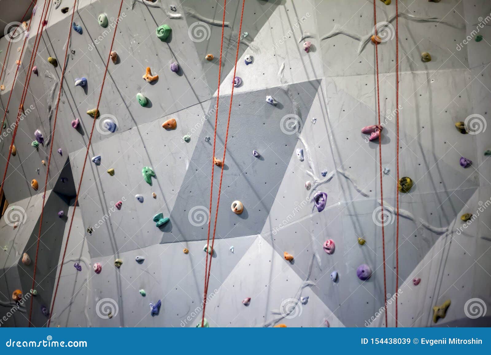 Wall for Climbing Training, Gray Wall with Climbing Holds in Gym Stock