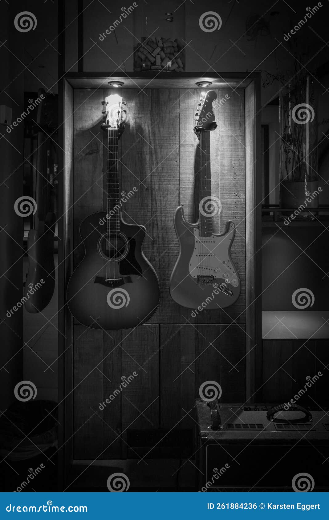 On a Wall Hang an Electric Guitar and an Acoustic Guitar Stock Photo