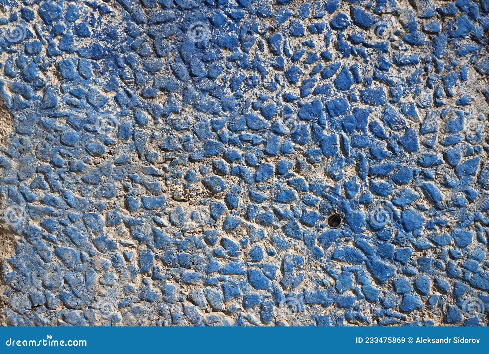 The Wall is Lined with Pebbles and Painted with Blue Paint, Blue Stone