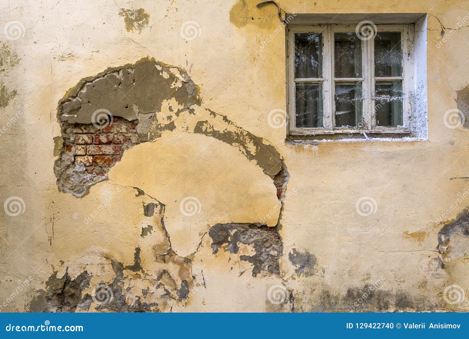 The Wall of an Old House with a Window. the Wall Needs Repair