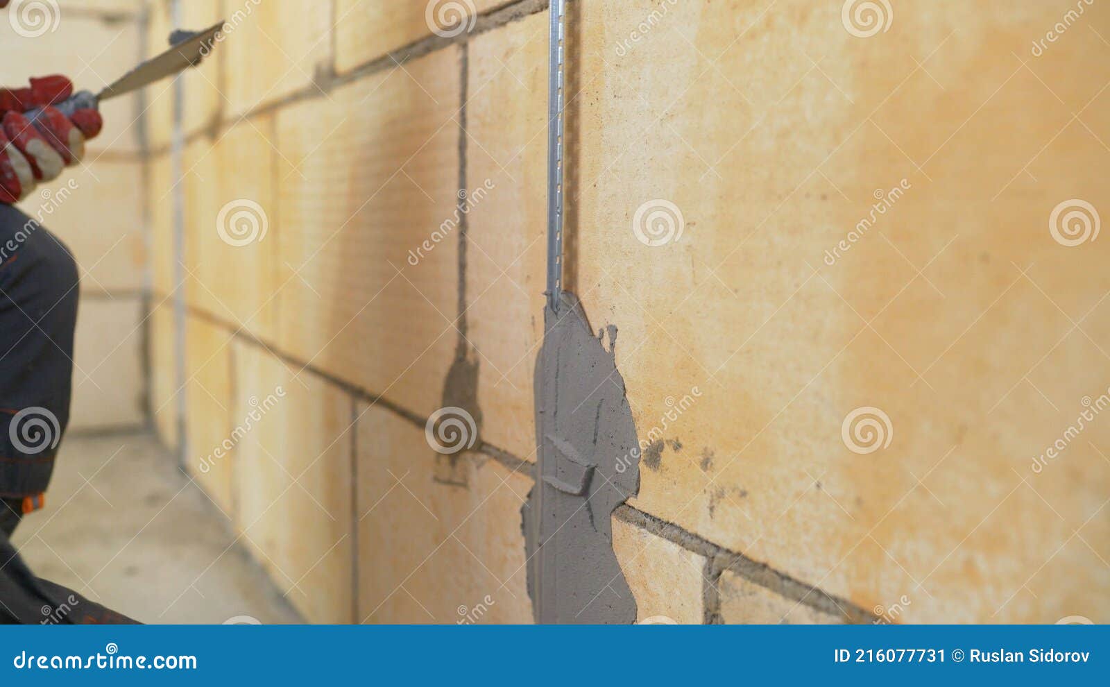 Wall Repair with Mortar. Plasterer at Work. Fastening Building Beacons