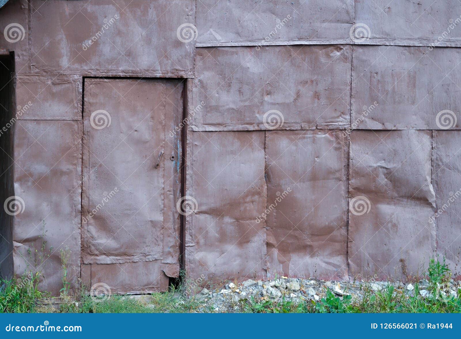 Wall Of Sheets Of Iron. The Door Is Lined With Sheets Of Iron