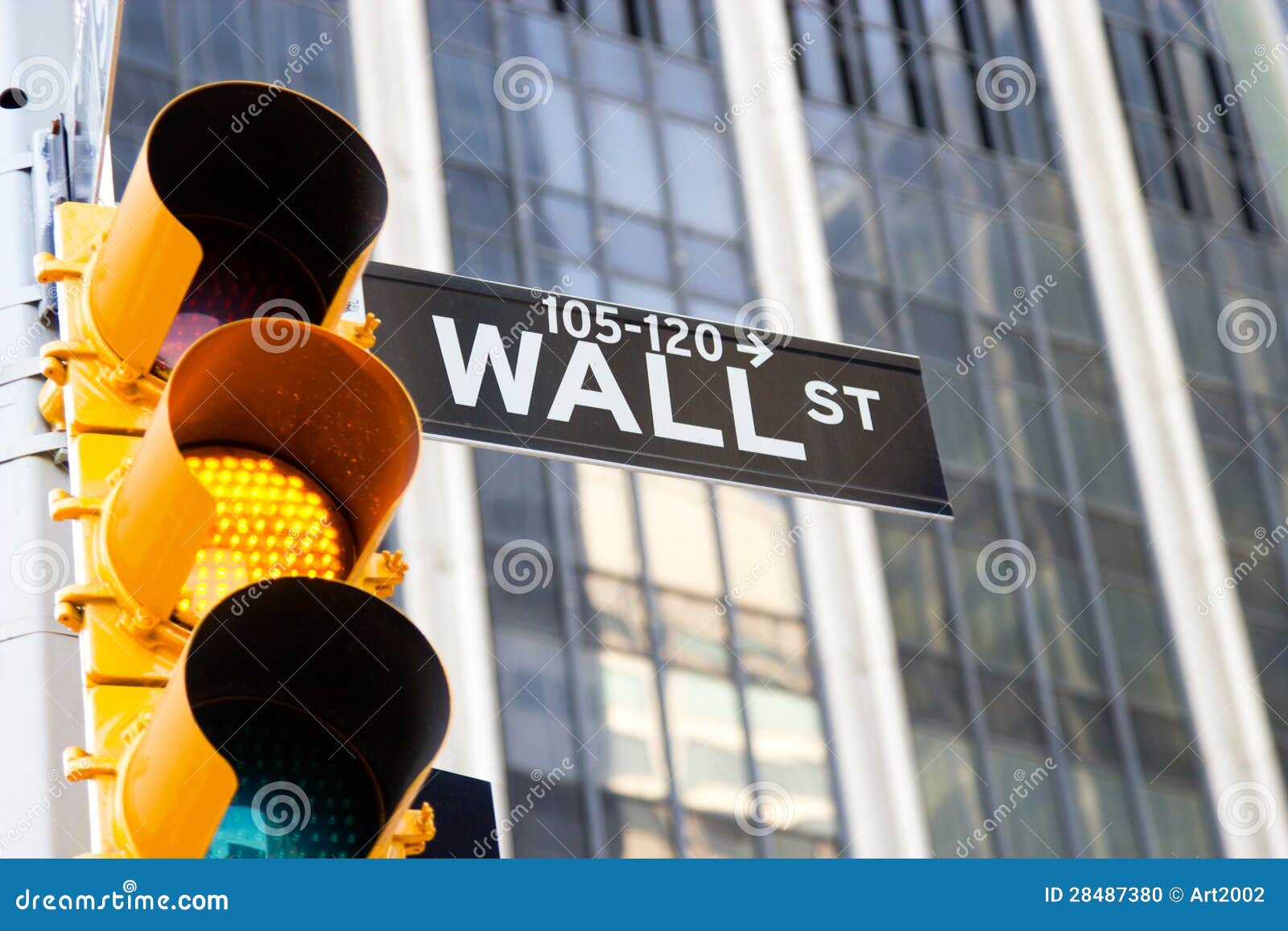 wall street sign and yellow traffic light, new york