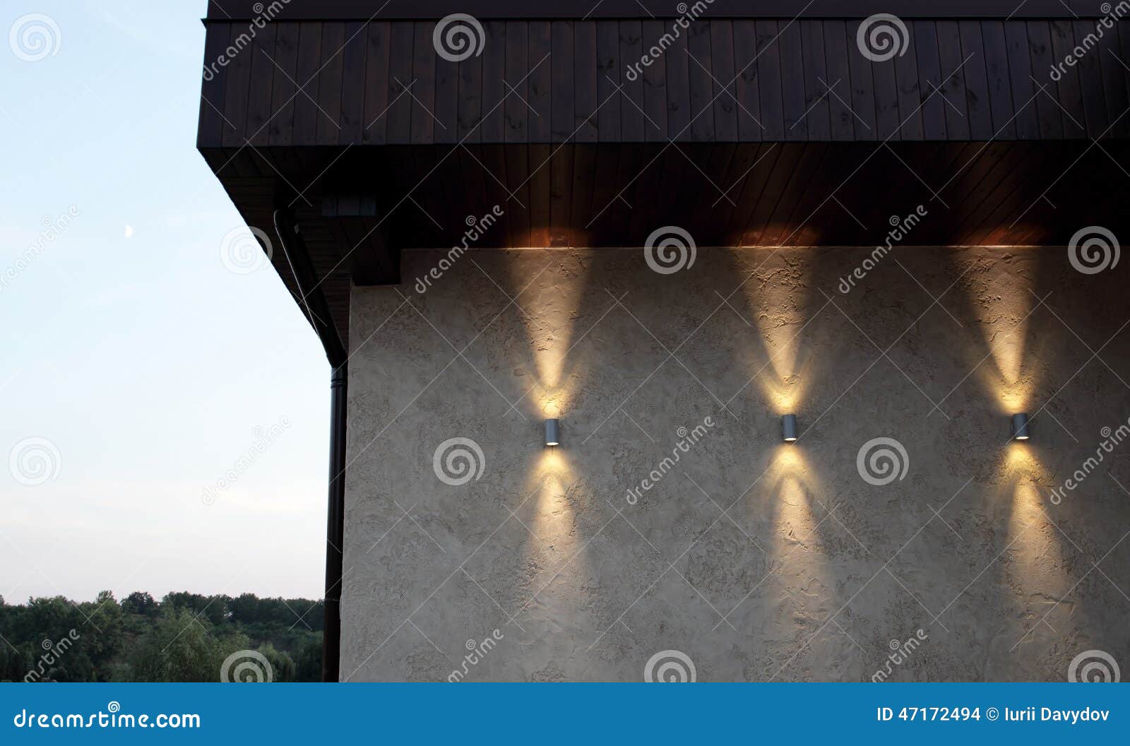 Wall with Three Lamps that Shine Up and Down Stock Photo Image of