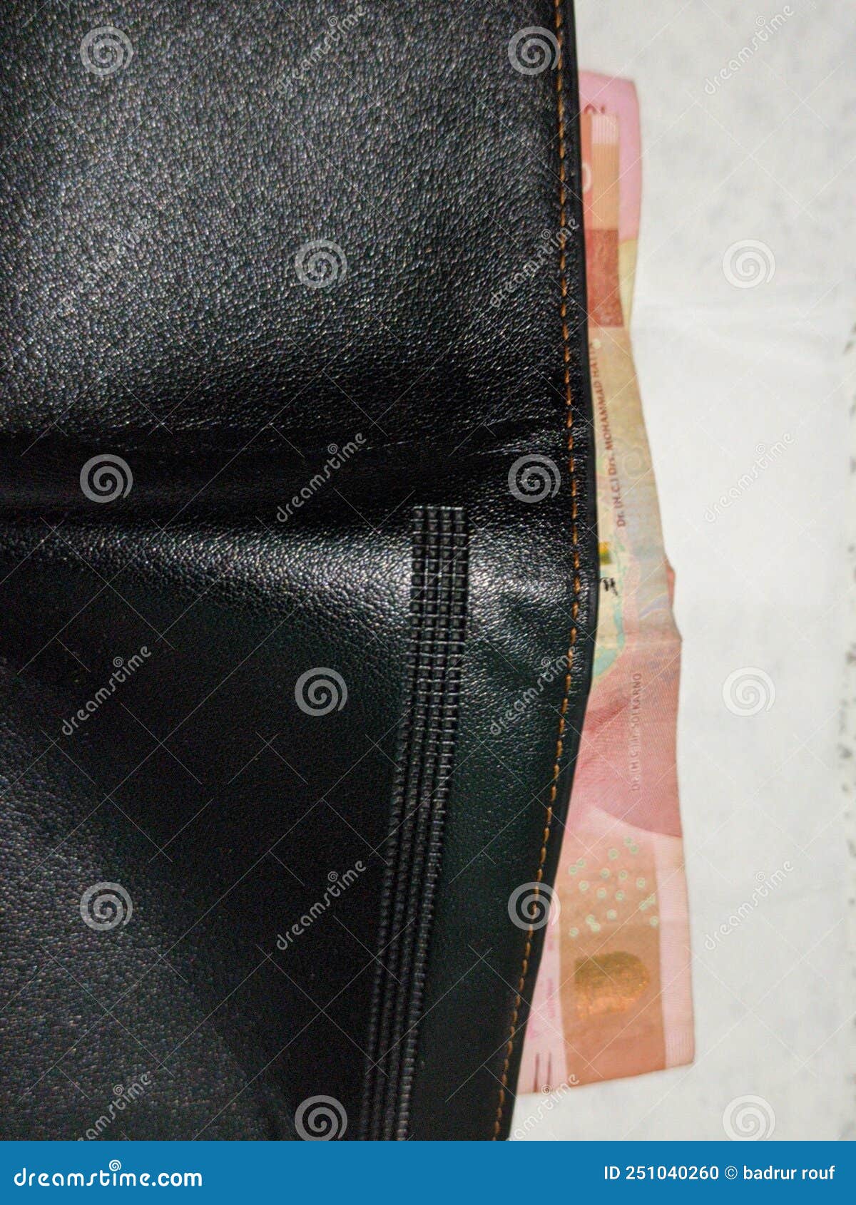 Wallet and 2 rupiah bills stock photo. Image of indonesian - 251040260