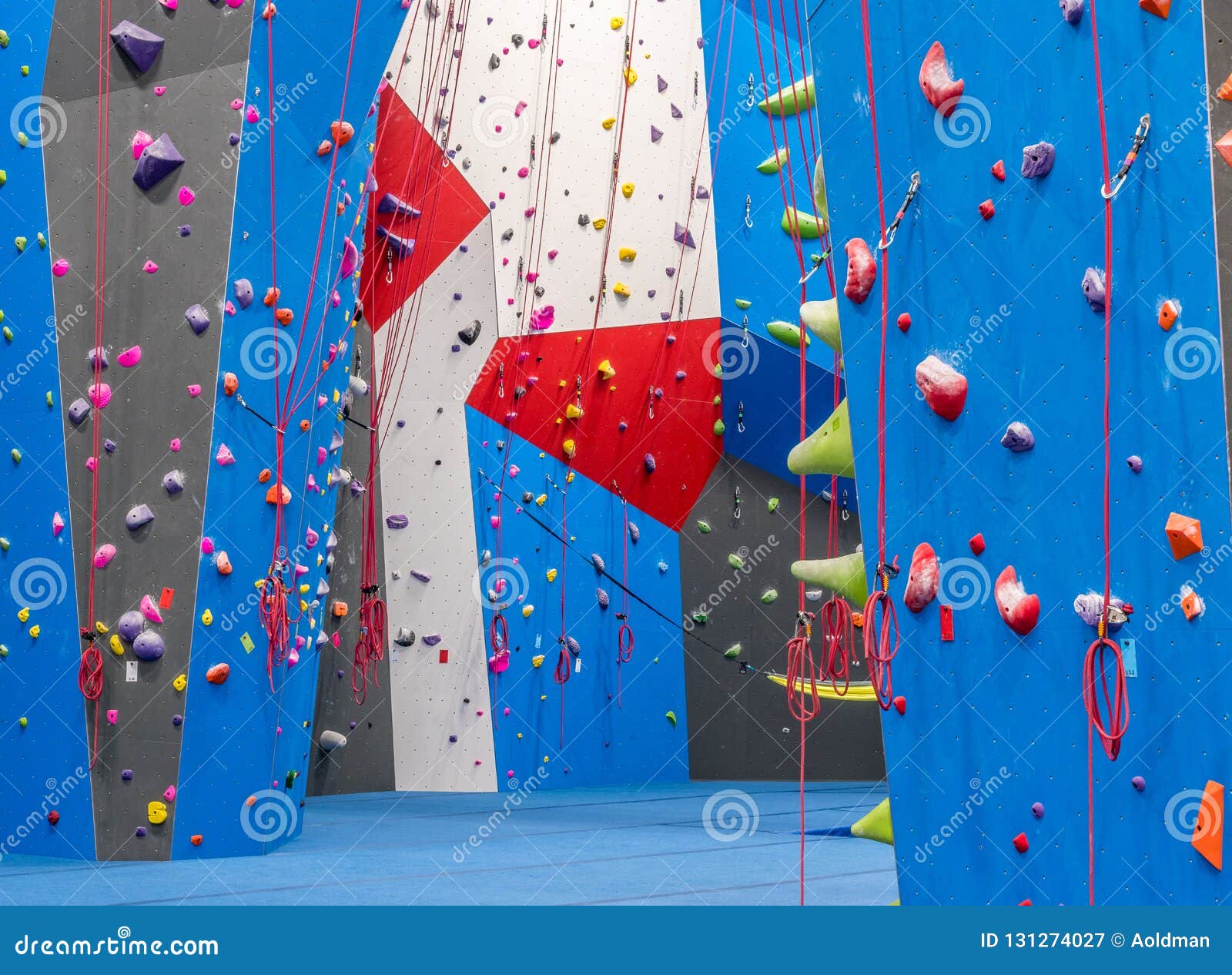 Indoor rock climbing gym stock image. Image of exercise 131274027