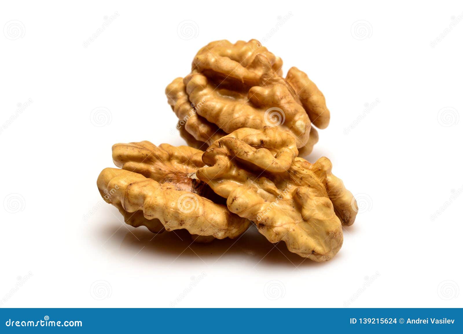 Walnut Kernels, One Whole And Two Halves Of The Walnut Kernel, Closeup Macro, Isolated On A