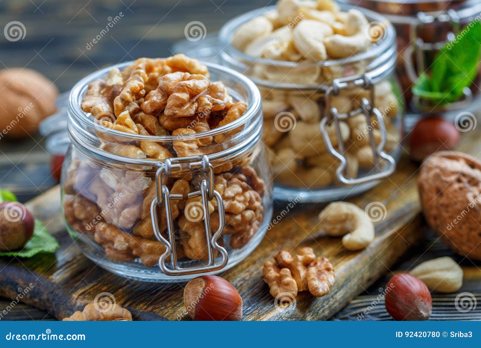 Walnuts and Cashews in Glass Jars. Stock Photo Image of brown, white