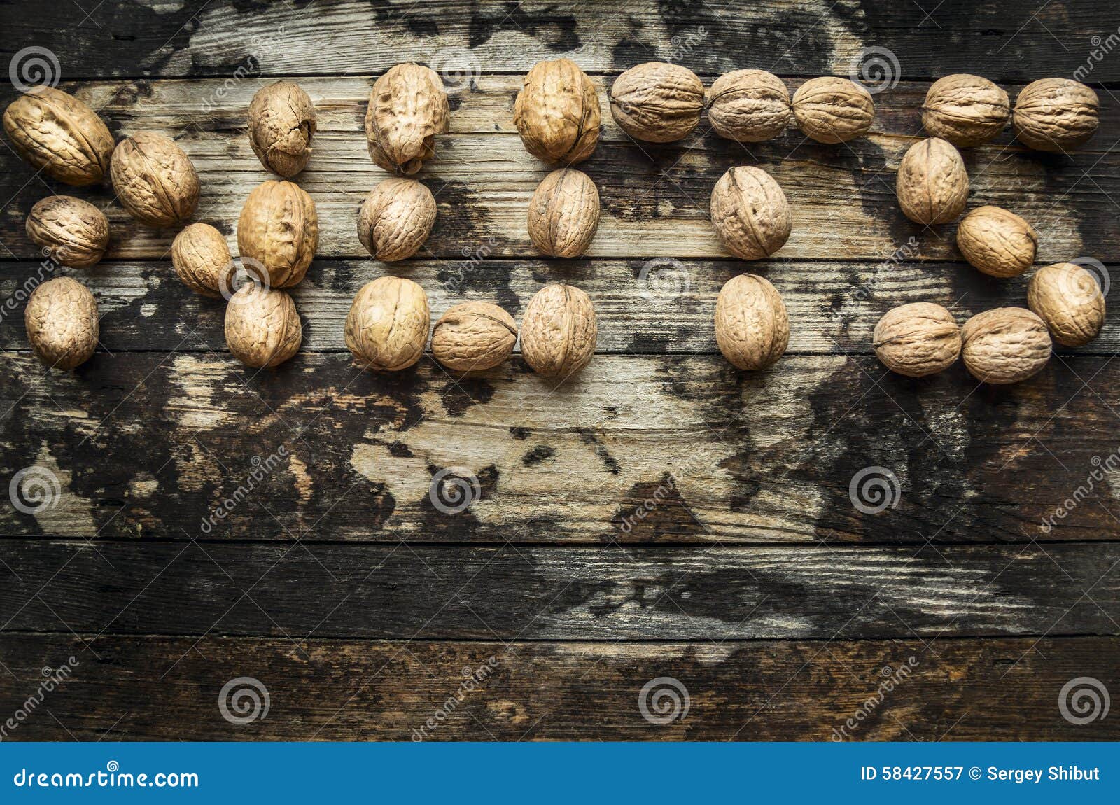 Walnuts, Laid Out in the Word Nuts on Wooden Rustic Background, Top