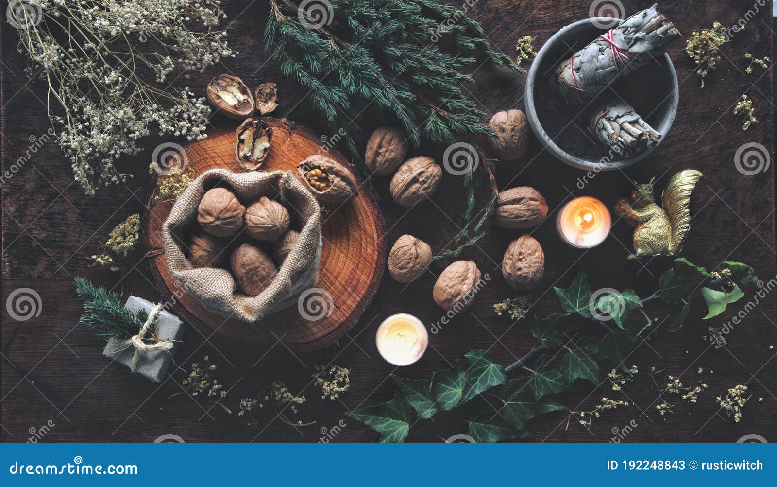 walnuts in small brown sack and all over wiccan witch altar as method of  divination for yule winter solstice christmas time