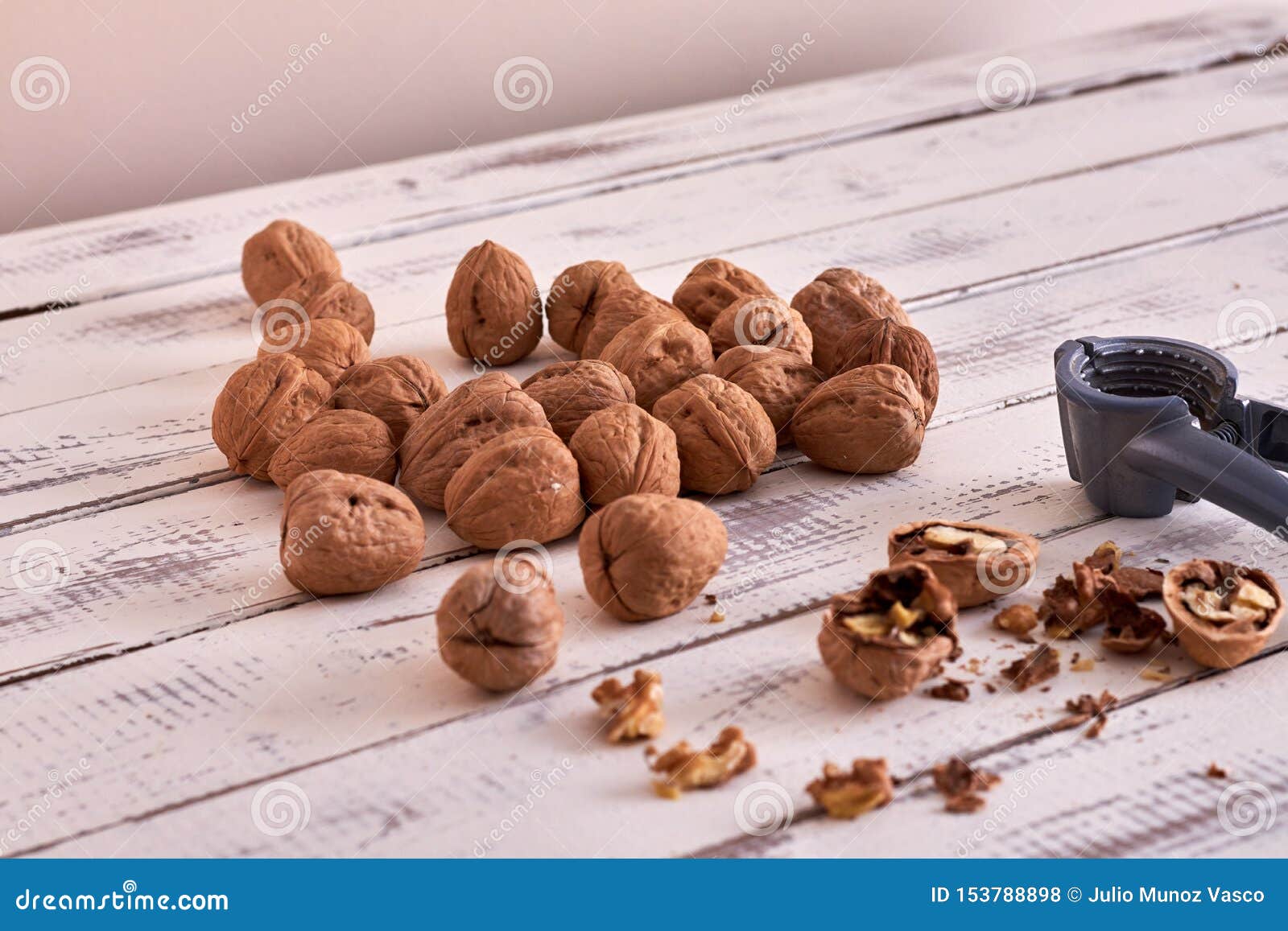 Walnuts on Table and Open Walnuts, Some Open Stock Photo Image of