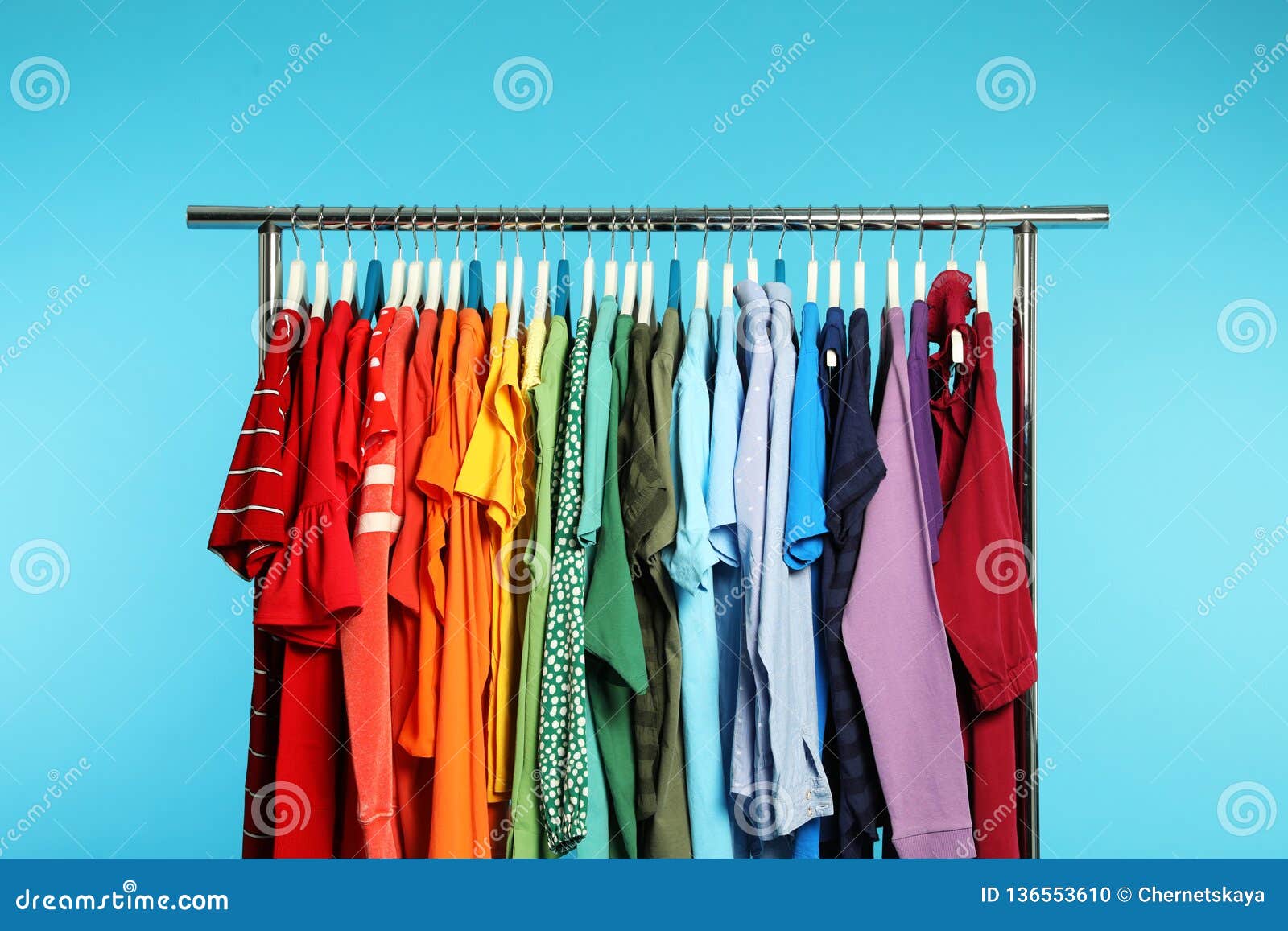 wardrobe rack with different bright clothes