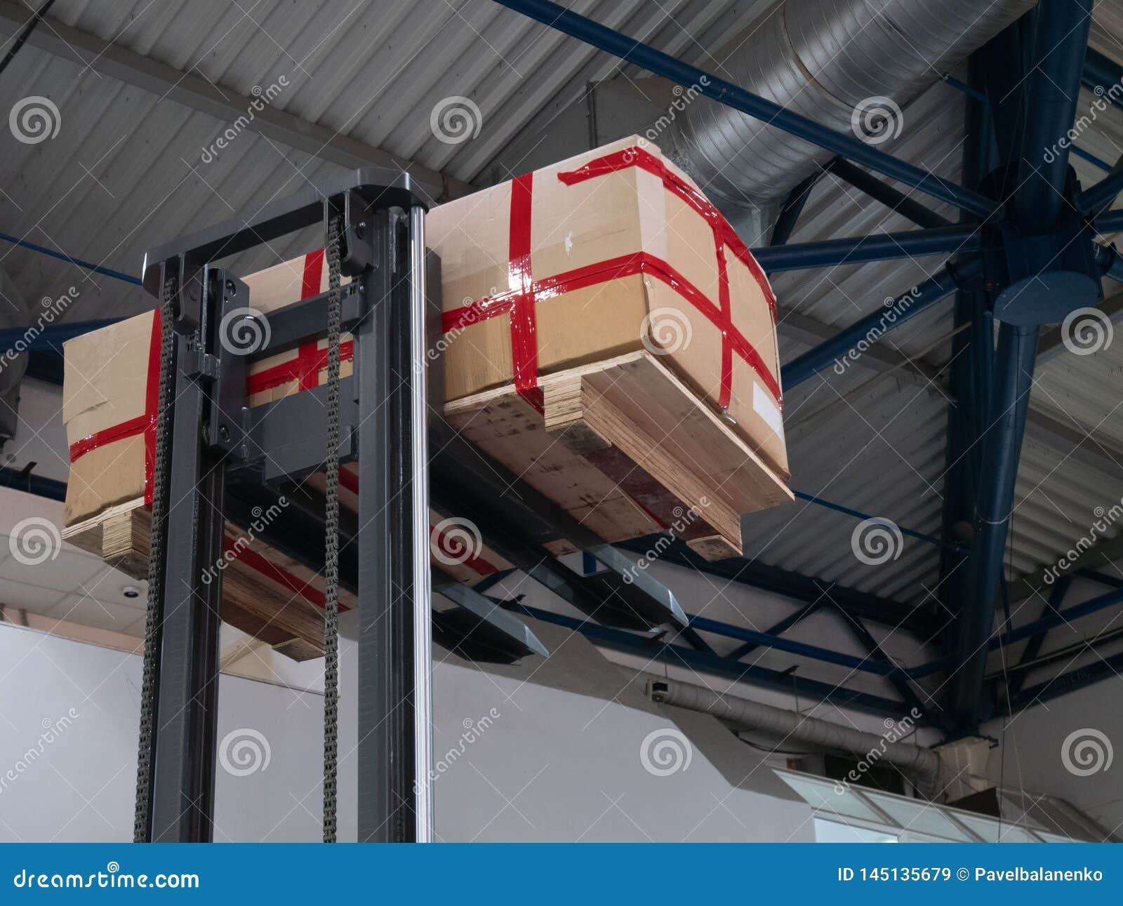 Warehouse Loader Forklift Lifting Pallet with Big Box Package at Diy