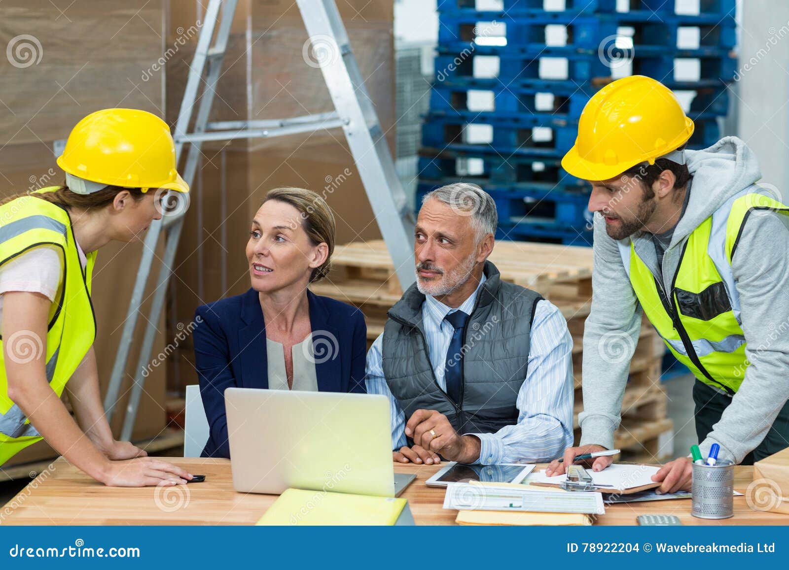 Warehouse Managers Interacting with Workers Stock Photo Image of