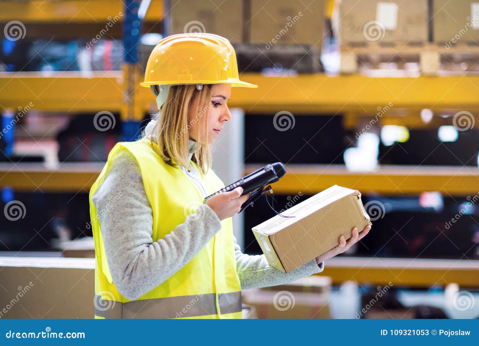 warehouse woman worker with barcode scanner.