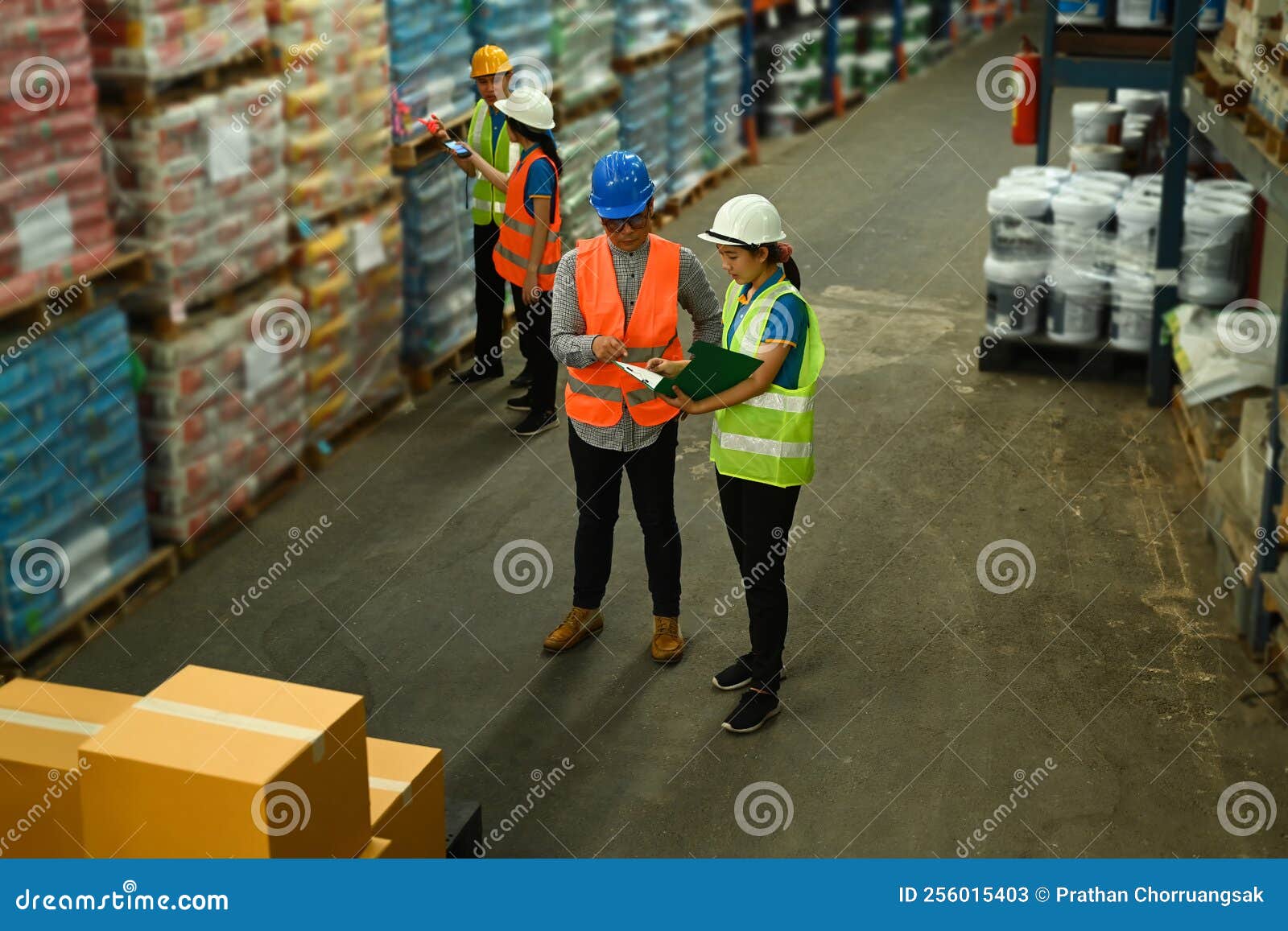 Warehouse Worker and Manager Checking Order Details on a Tablet while
