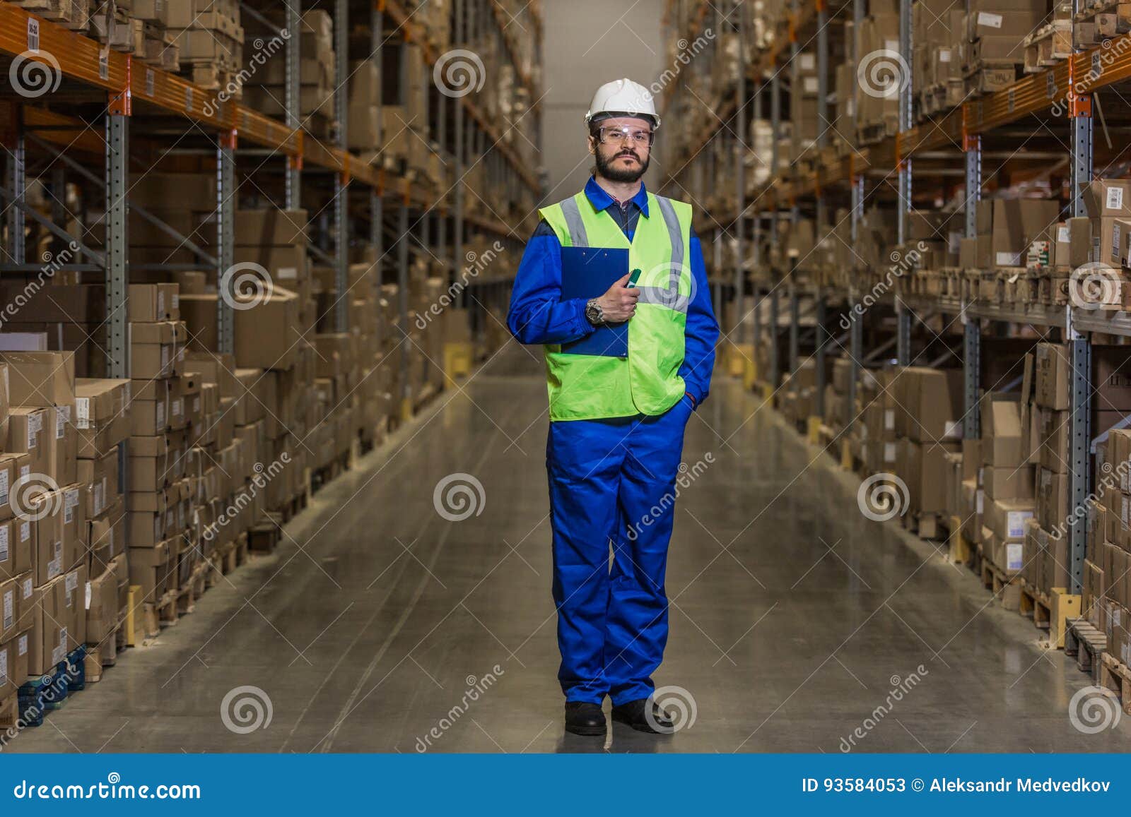 Warehouse Worker Standing between Rows with Boxes Stock Image Image