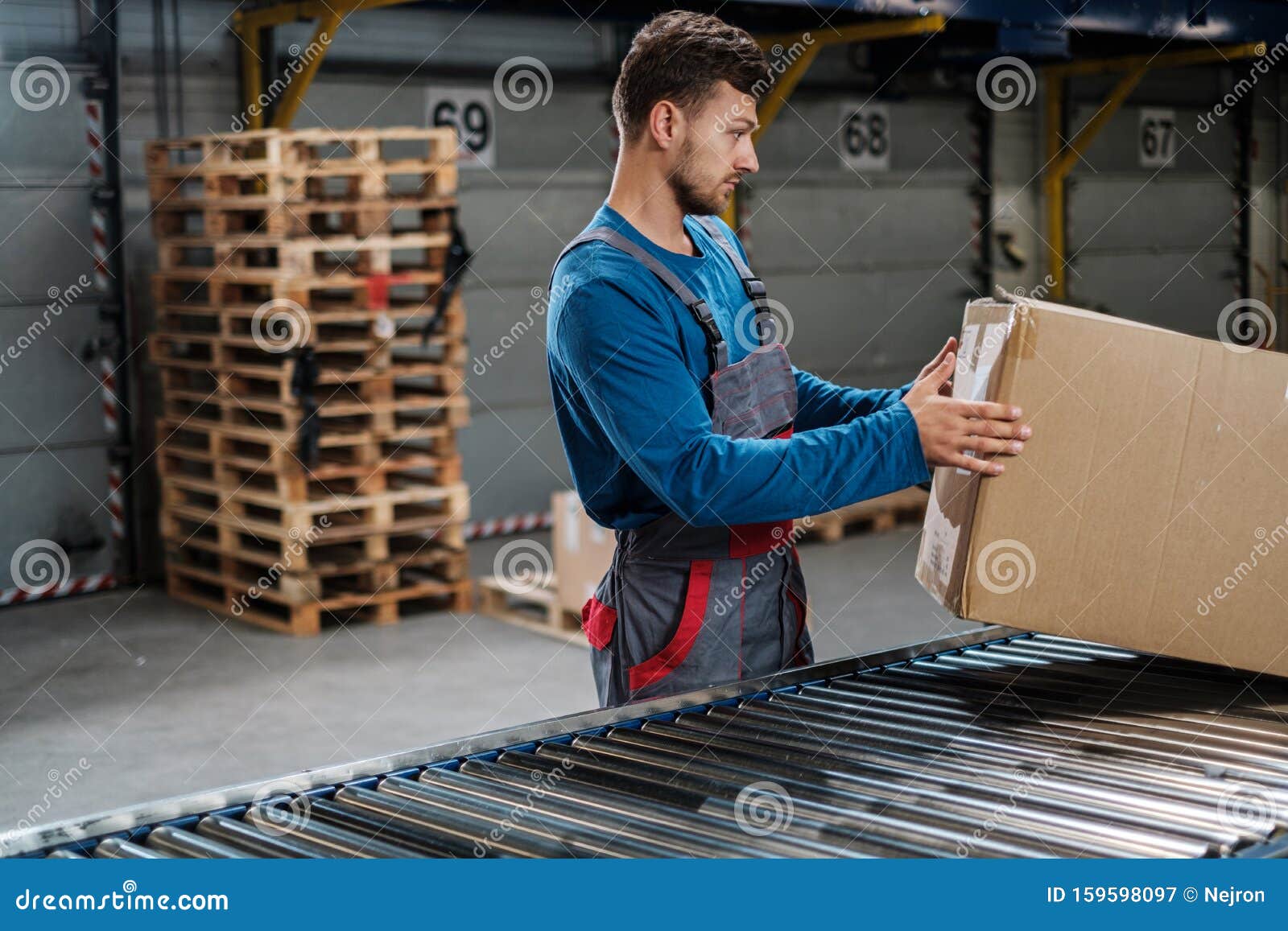 Warehouse Worker Working on a Conveyor Line Stock Image Image of