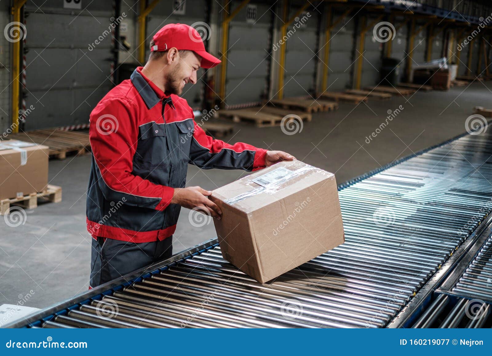 Warehouse Worker Working on a Conveyor Line Stock Image Image of