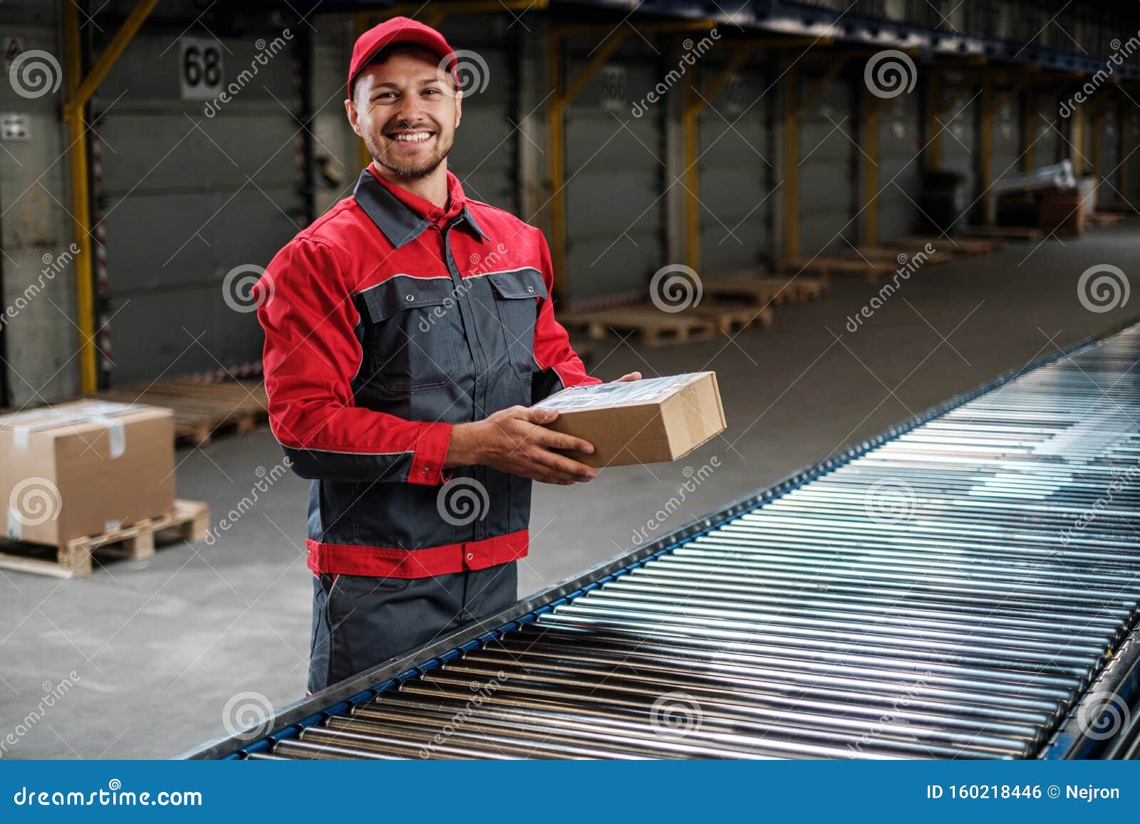 Warehouse Worker Working on a Conveyor Line Stock Photo Image of
