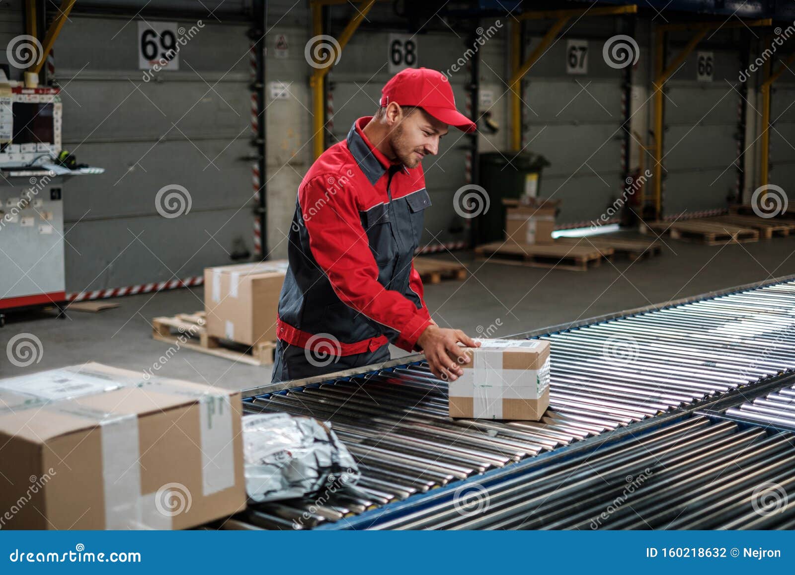 Warehouse Worker Working on a Conveyor Line Stock Photo Image of
