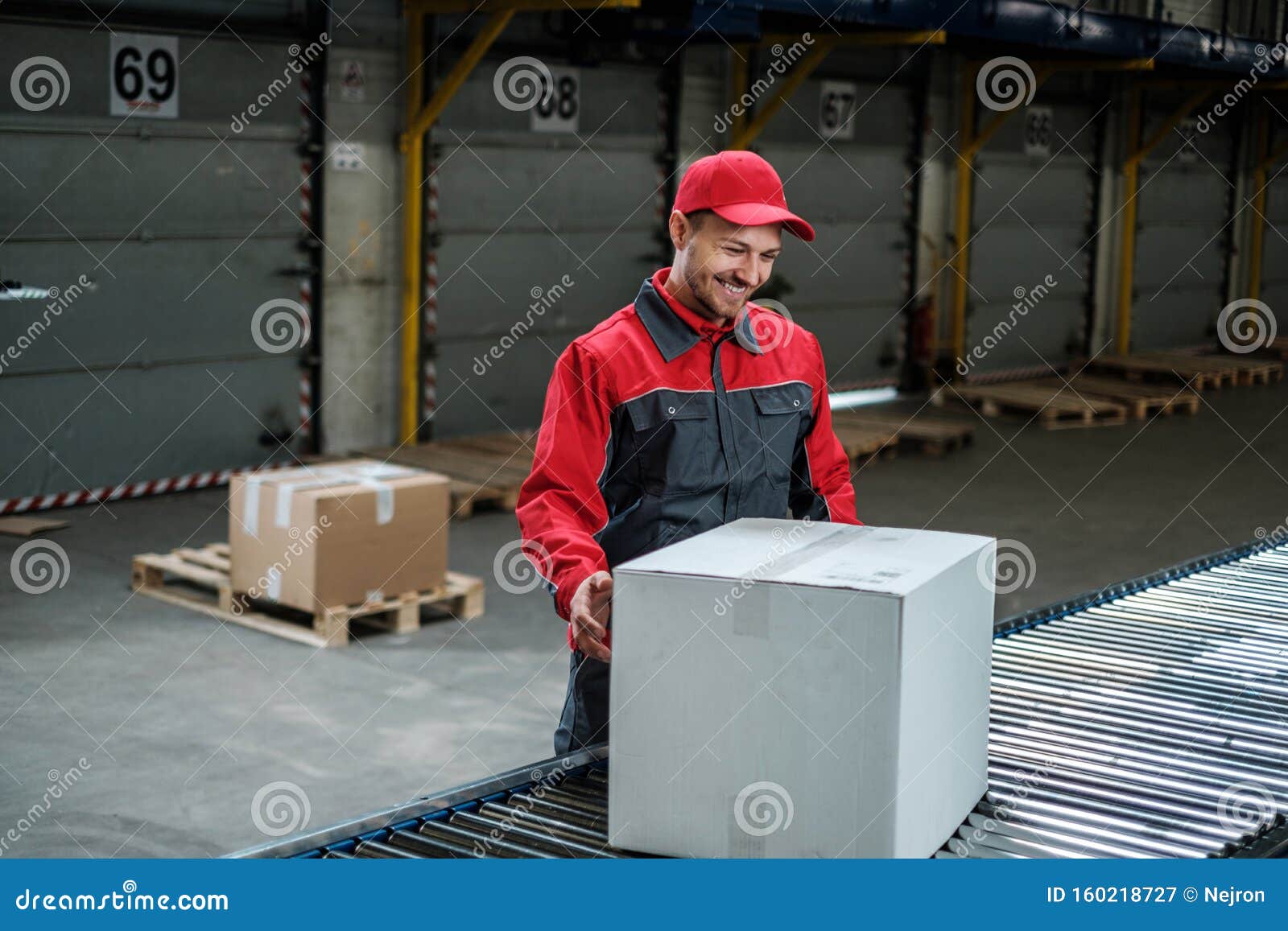 Warehouse Worker Working on a Conveyor Line Stock Image Image of