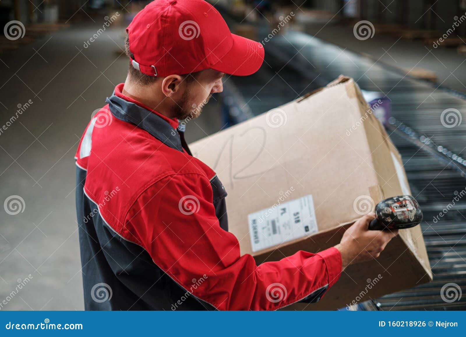Warehouse Worker Working on a Conveyor Line Stock Photo Image of
