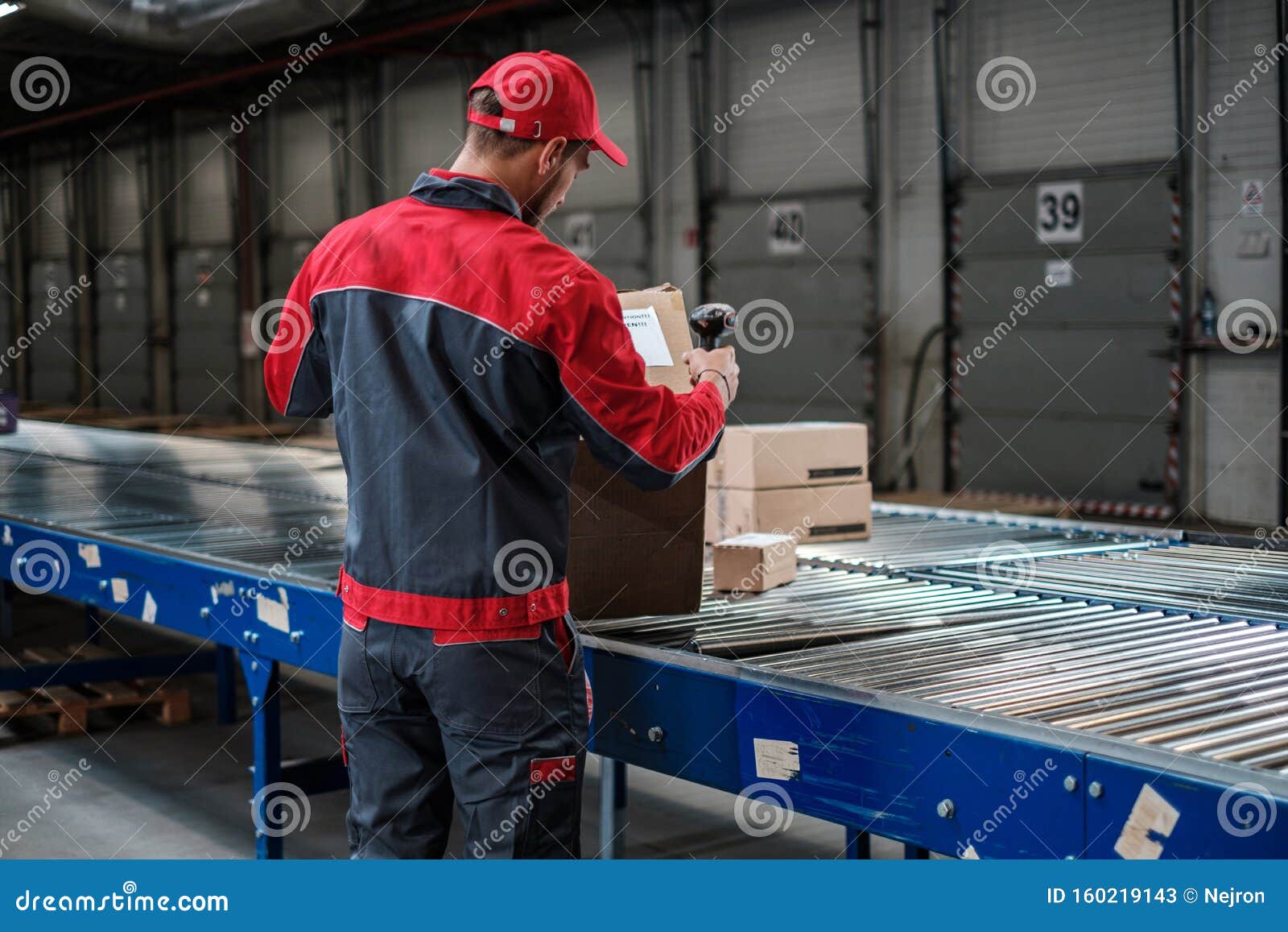 Warehouse Worker Working on a Conveyor Line Stock Image Image of