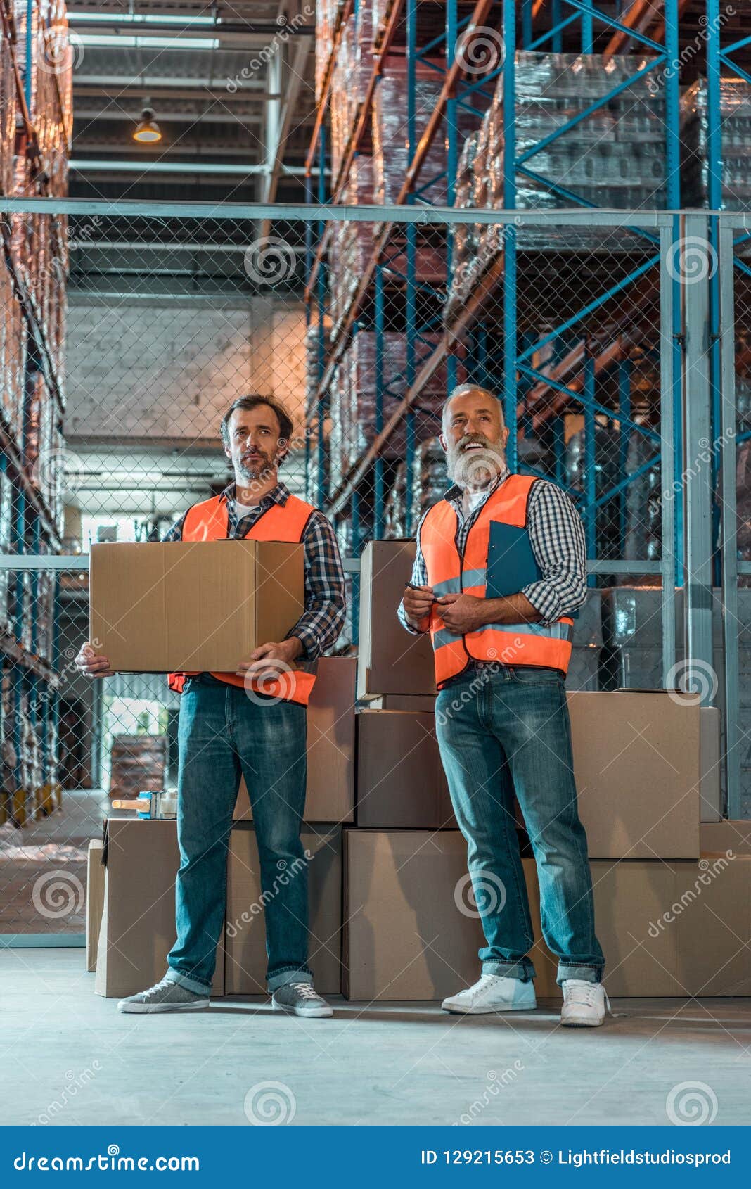 Warehouse Workers Standing with Clipboard and Box Stock Image Image