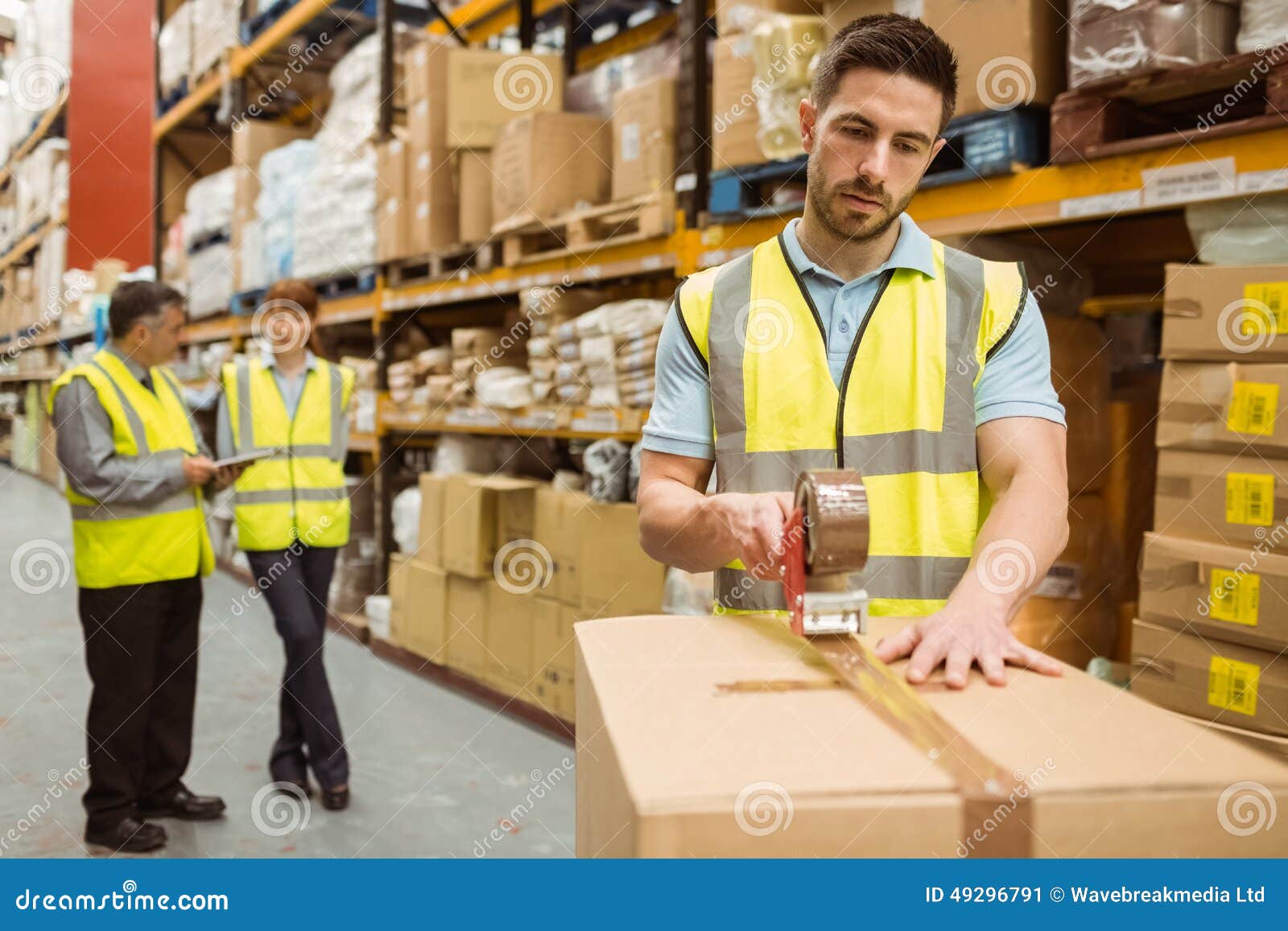 Warehouse Workers Preparing a Shipment Stock Image Image of holding