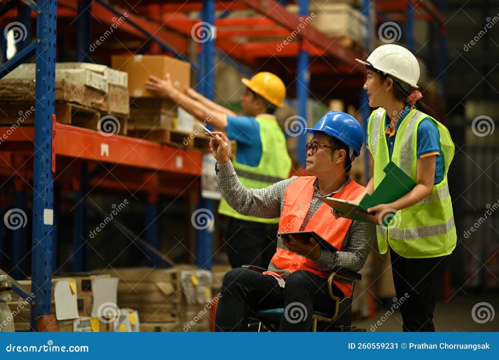 Warehouse Workers Working in the Retail Warehouse Full of Shelves with
