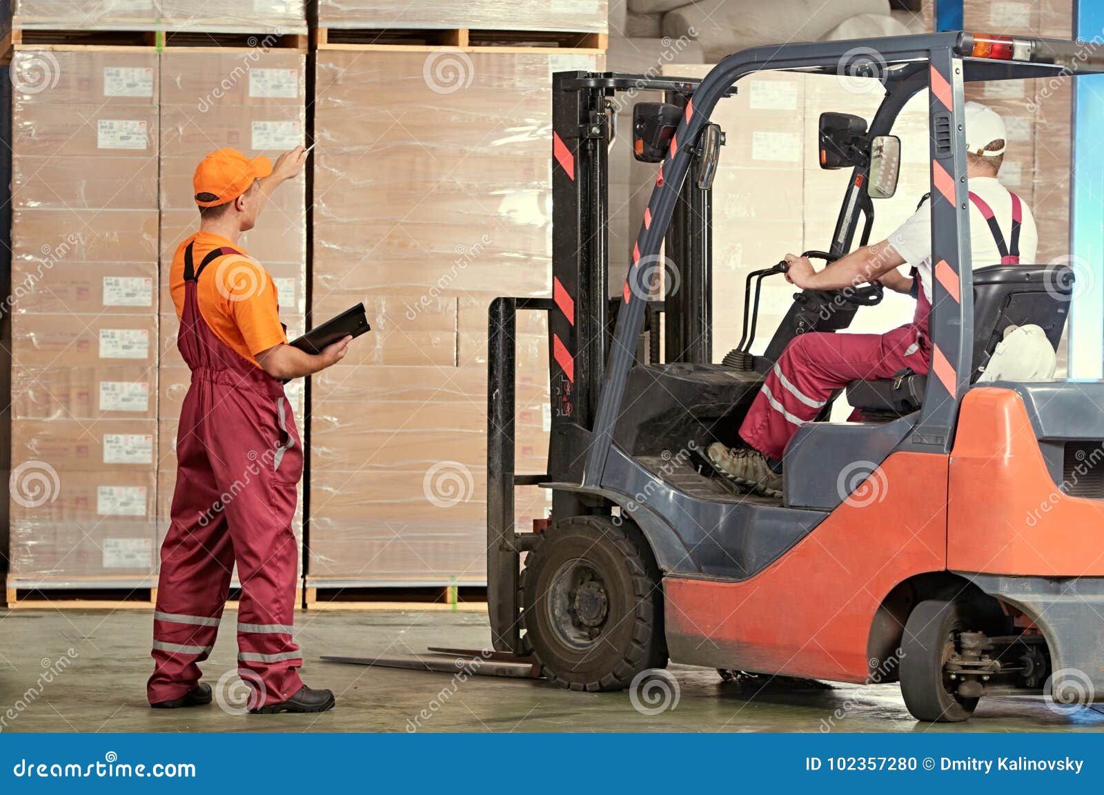 Warehousing and Storage. Warehouse Workers Works with Forklift Loader