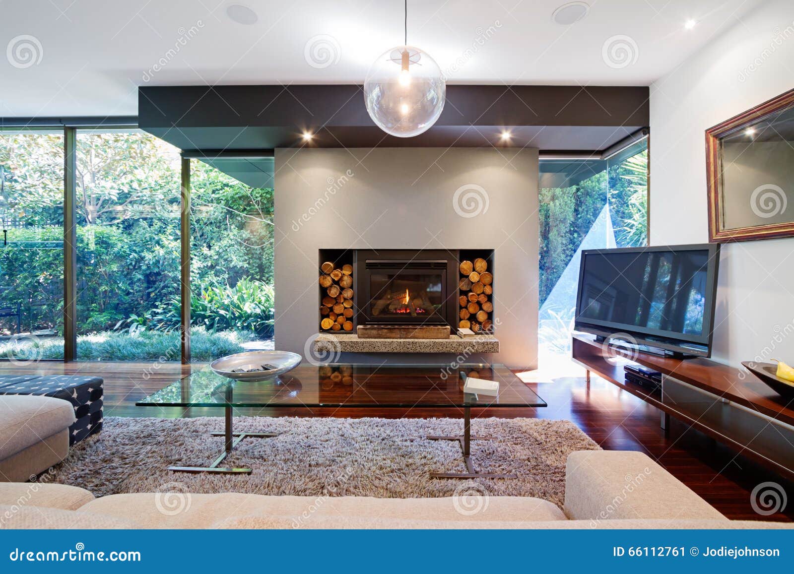 warm australian living room with fireplace in luxury home