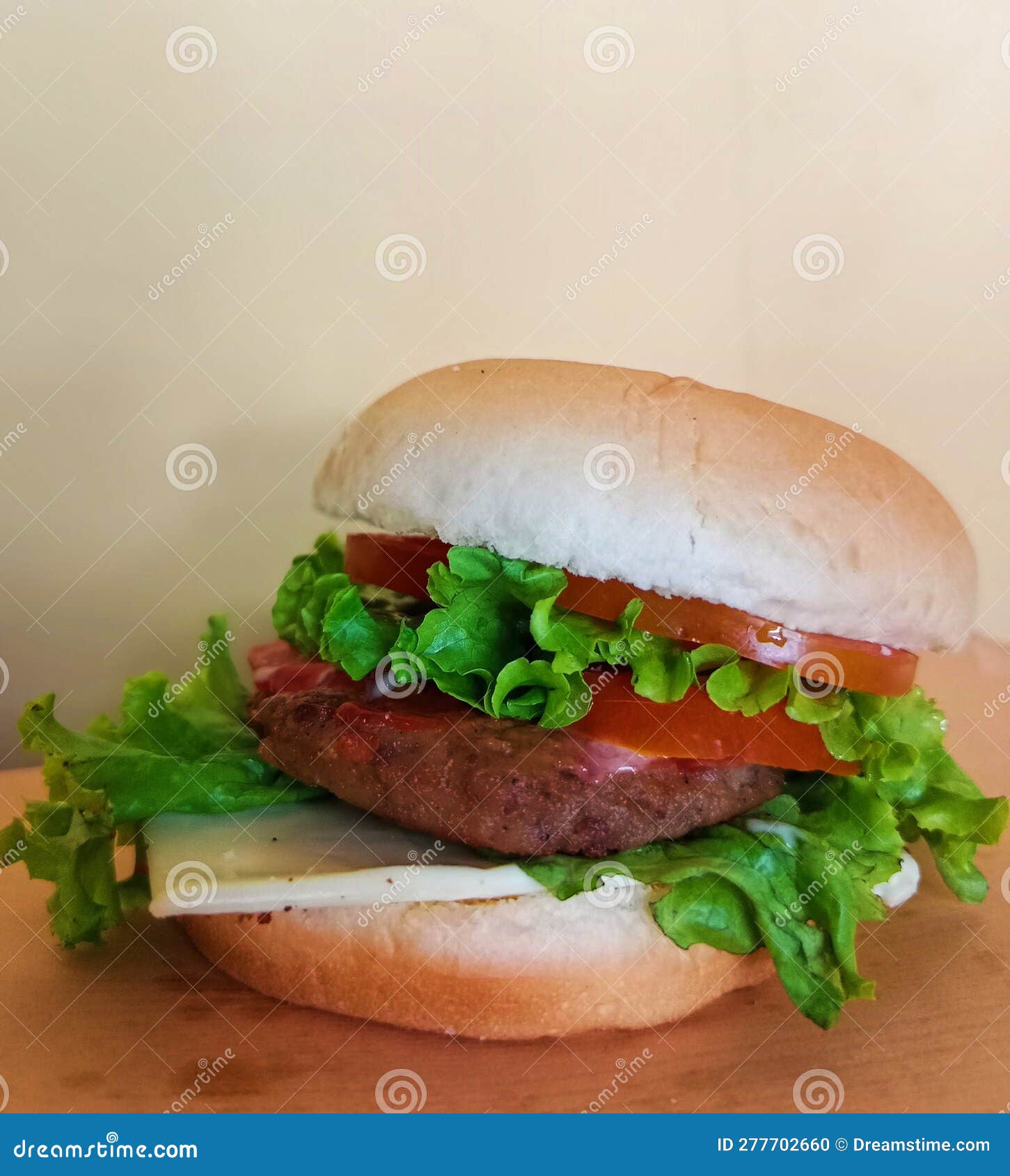 Warm Burger with Beef, Lettuce, Tomato and Chili Sauce and Mayonnaise