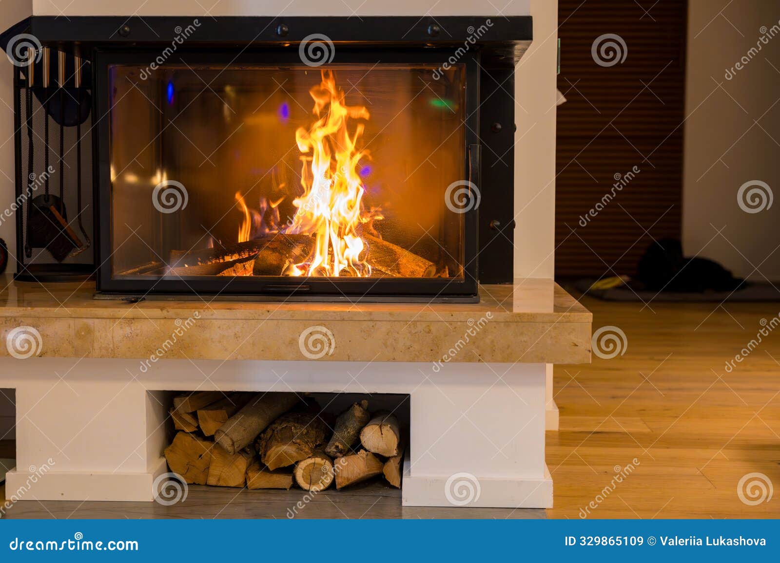 warm cozy fireplace burning wood logs on a cold winter evening