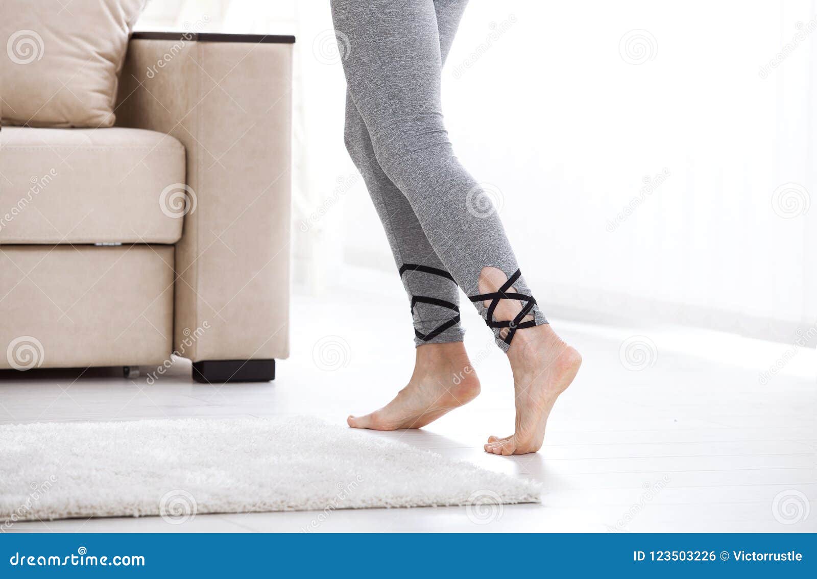 Warm Floor Concept. Closeup of Female Legs Stepping by Hardwood Floor ...