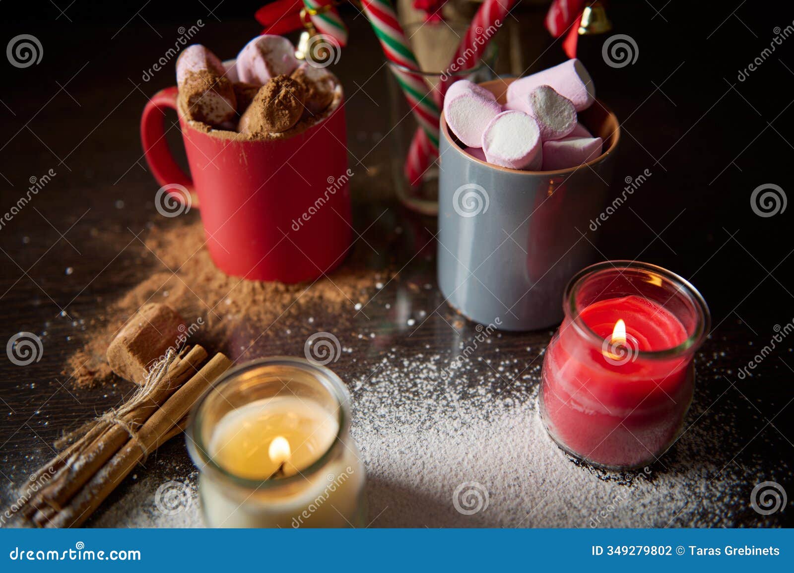 warm holiday scene with cocoa, marshmallows, cinnamon sticks, and candles