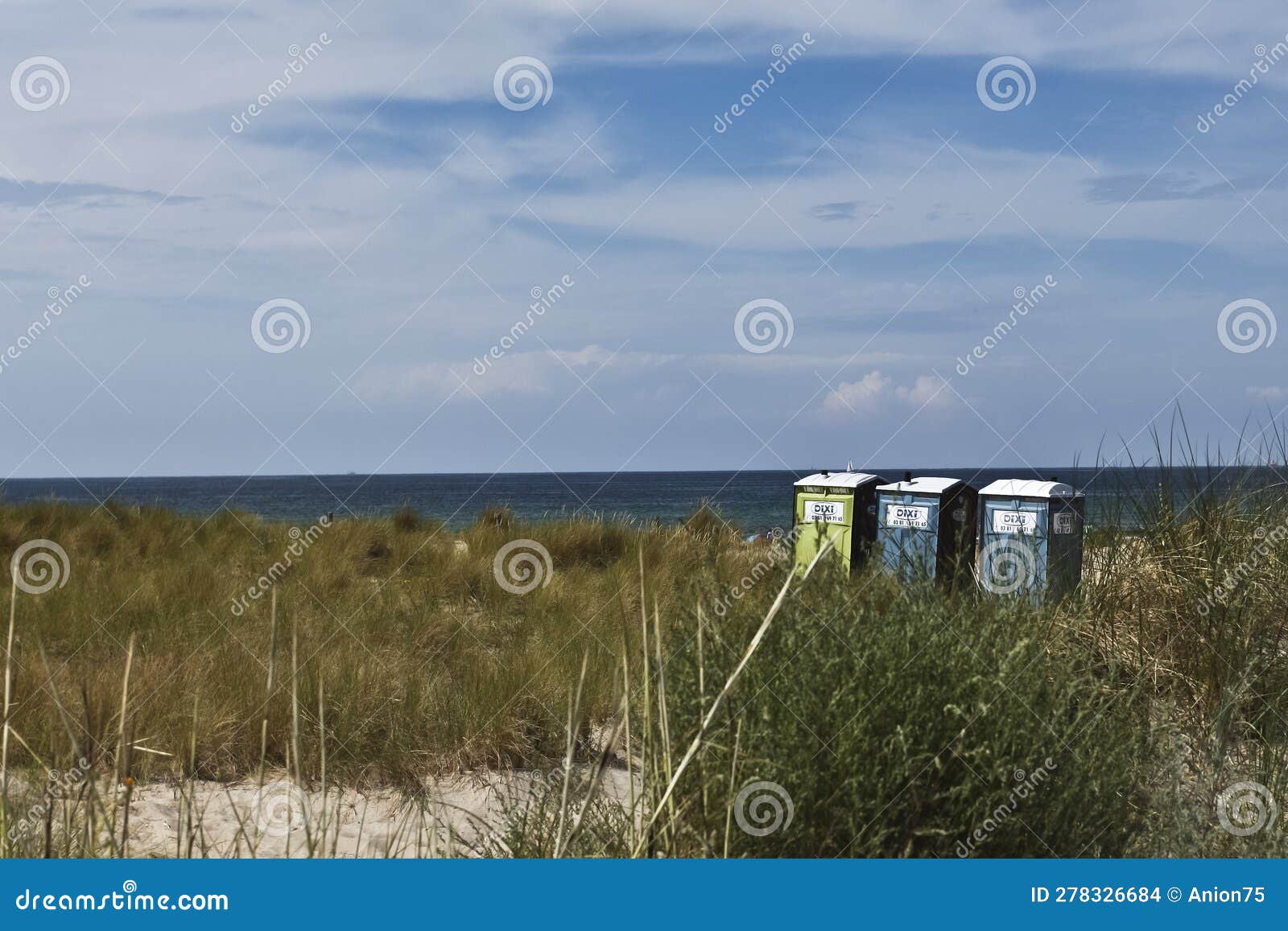 warnemÃ¼nde, germany, august 2013 three portable toilet on the beach