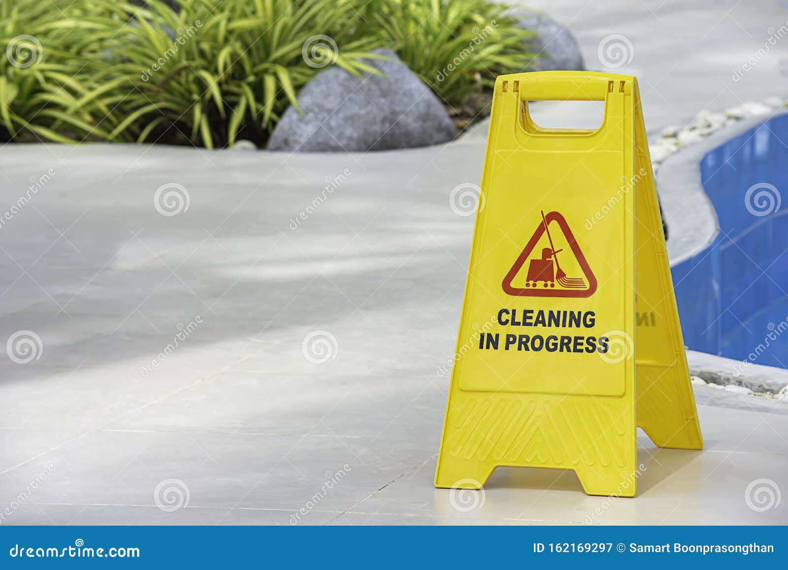 Warning Plates Cleaning In Progress Beside The Pool Made Of Yellow