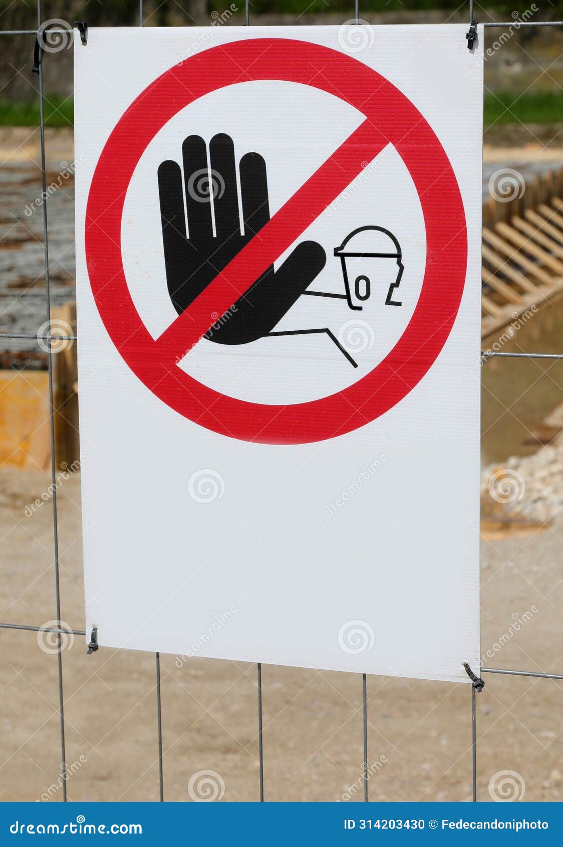 warning signage prohibiting access with hand to construction site area