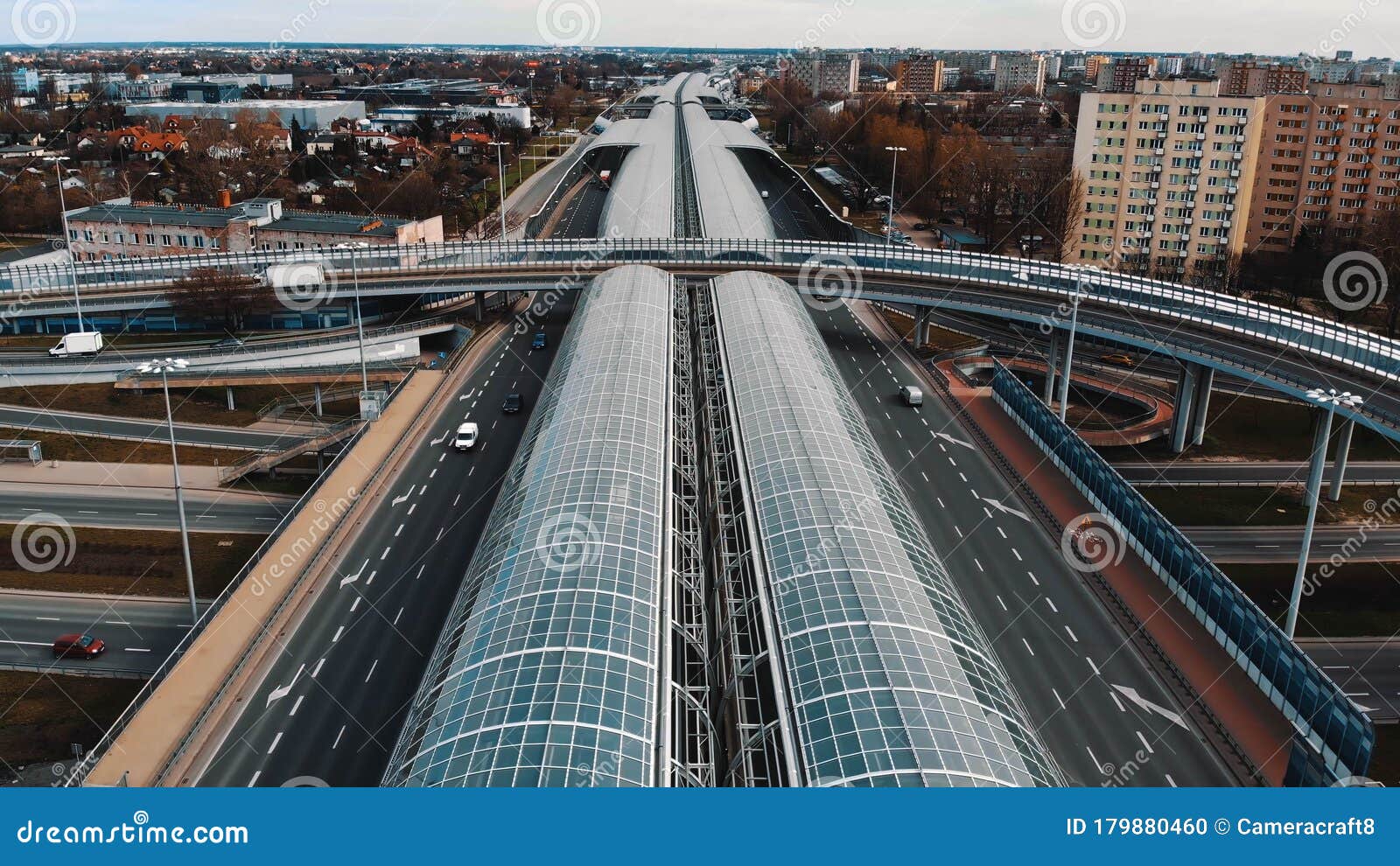 Warsaw, Poland, 03.20.2020. - The anti-noise glass tunnel and overpass Trasa Torunska highway in north-east Warsaw