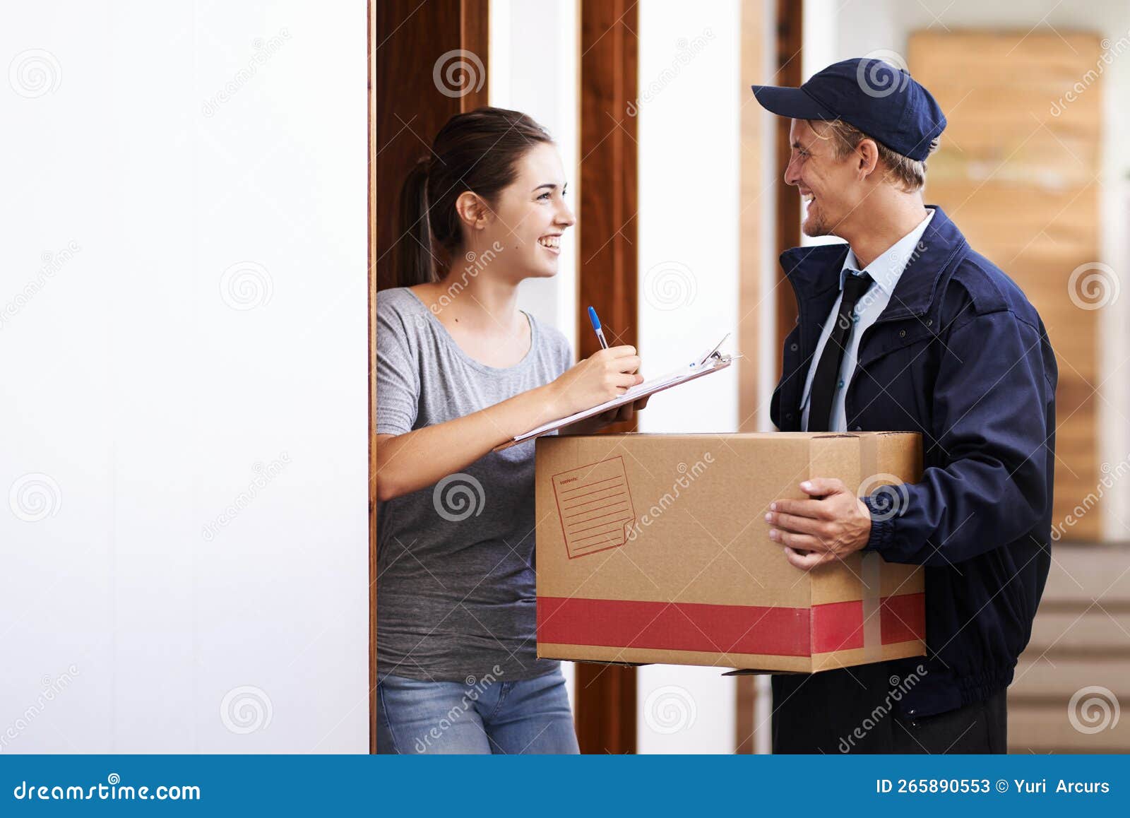 That Was Super Quick. a Courier Making a Delivery To a Smiling Customer
