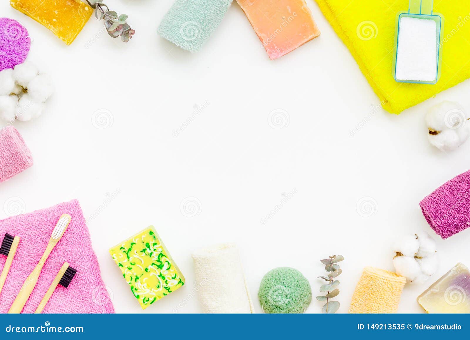 wash and care products and cotton towels frame on white background top view space for text