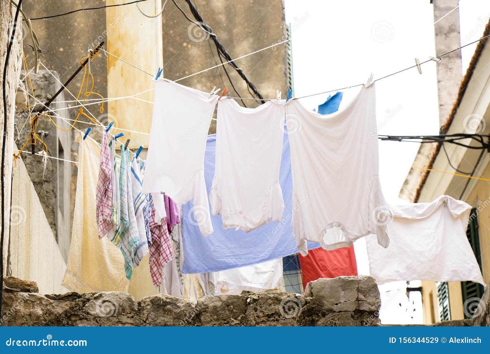 Washed Clothes Drying Outdoor while Hanging on a Rope on a Summer Day Stock  Image - Image of backyard, style: 156344529