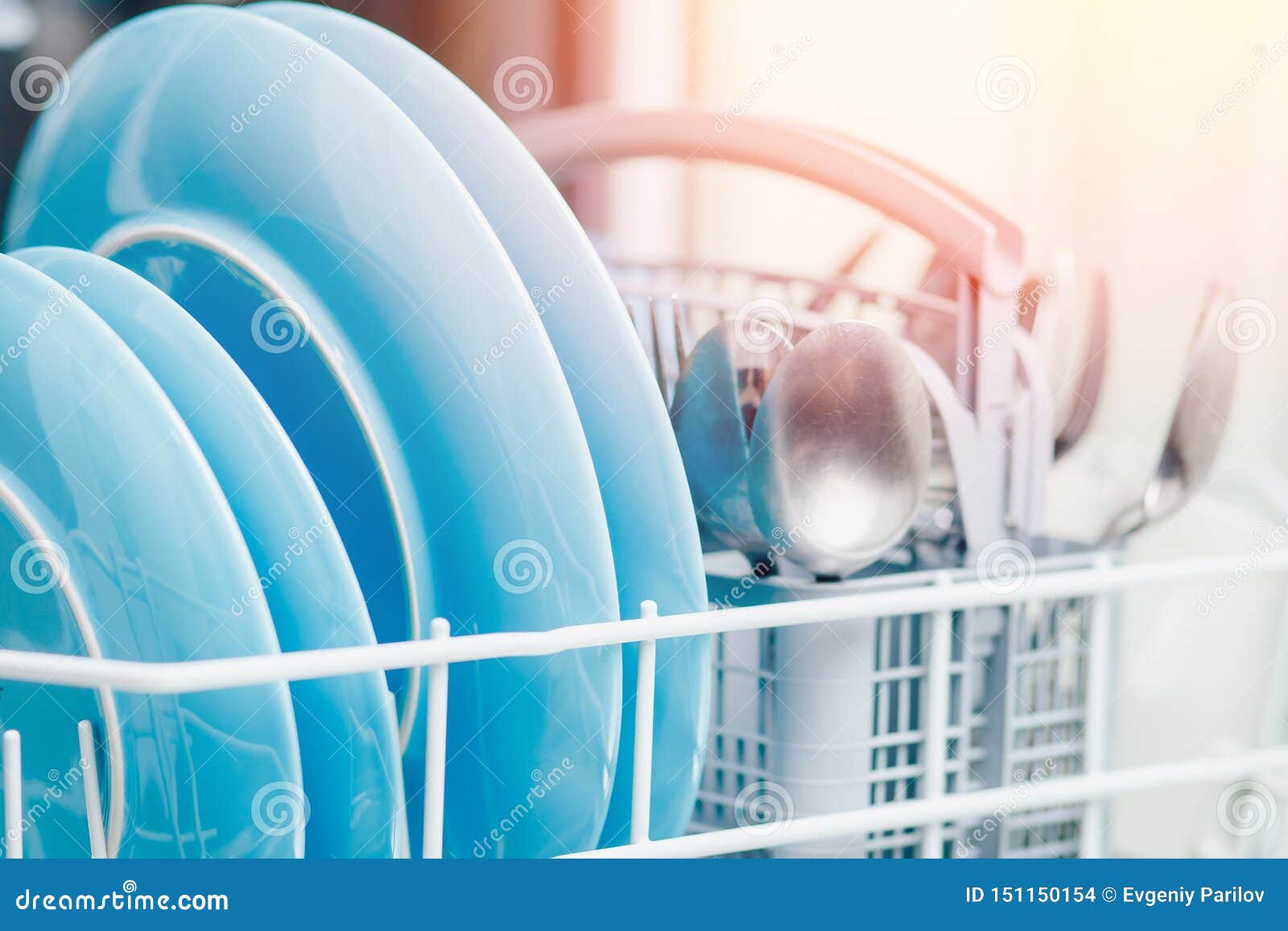 Washing Dishes in Dishwasher. Concept Water Saving Stock Photo Image