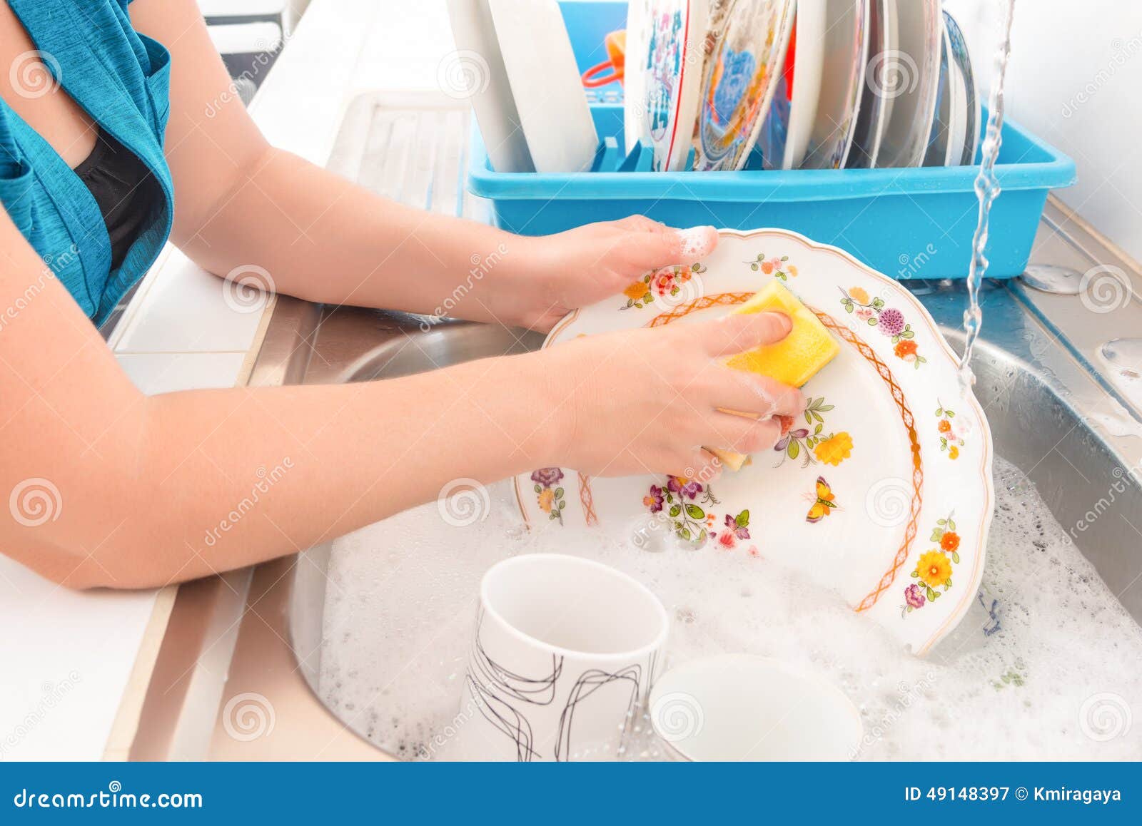 washing the dishes on the kitchen sink