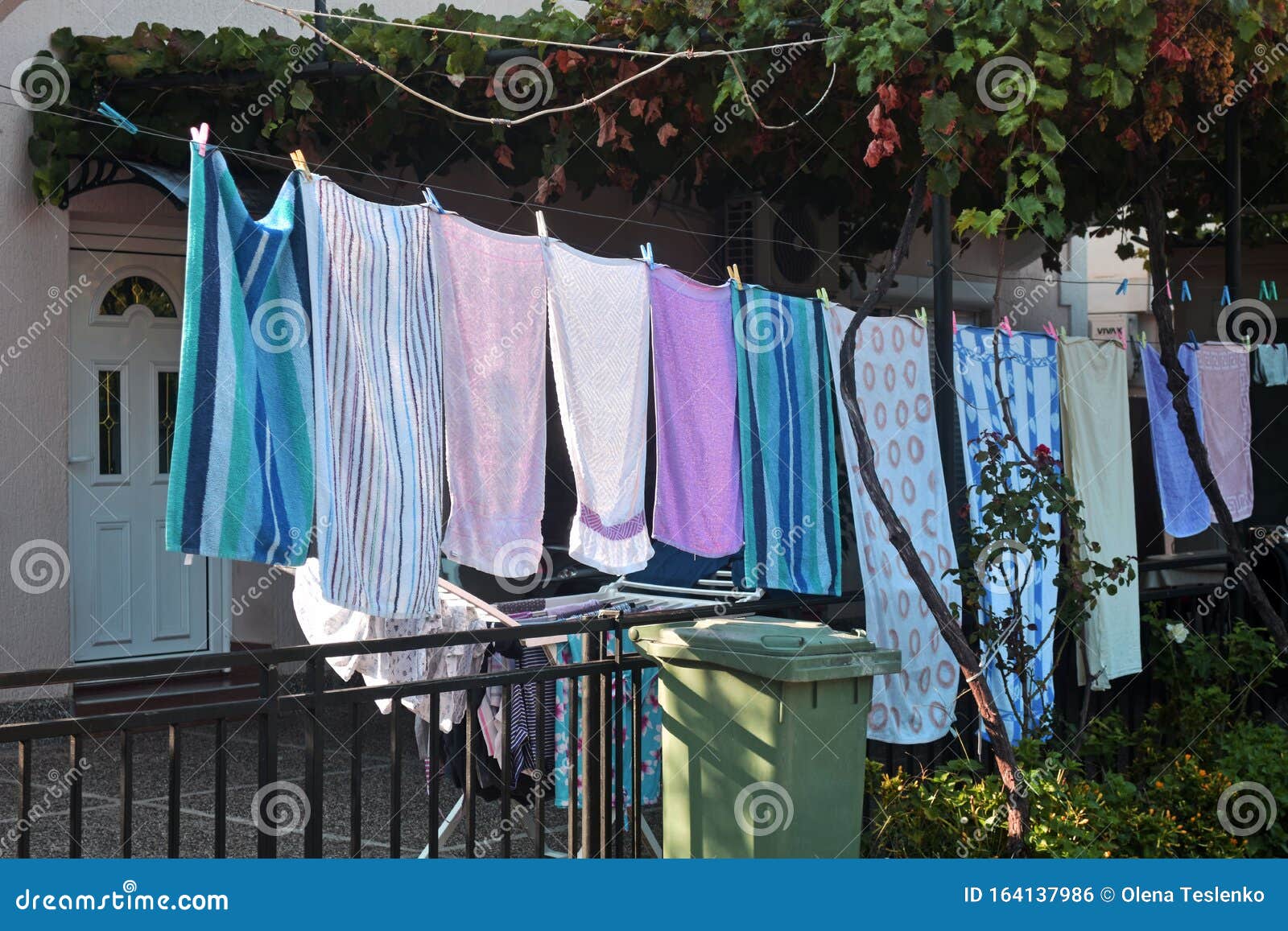 Washing Line with Drying Clothes in Outdoor. Clothes Hanging on Washing  Line Stock Photo - Image of attached, cloth: 164137986